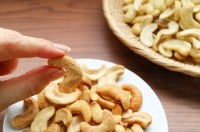 Eating cashew nuts Getty