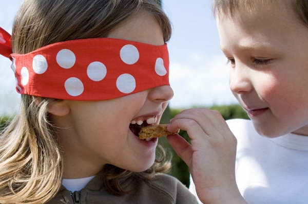 Kids eating biscuits Image source