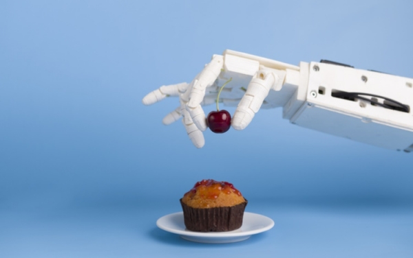 Robot putting cherry on top of cupcake Getty ProStock-Studio