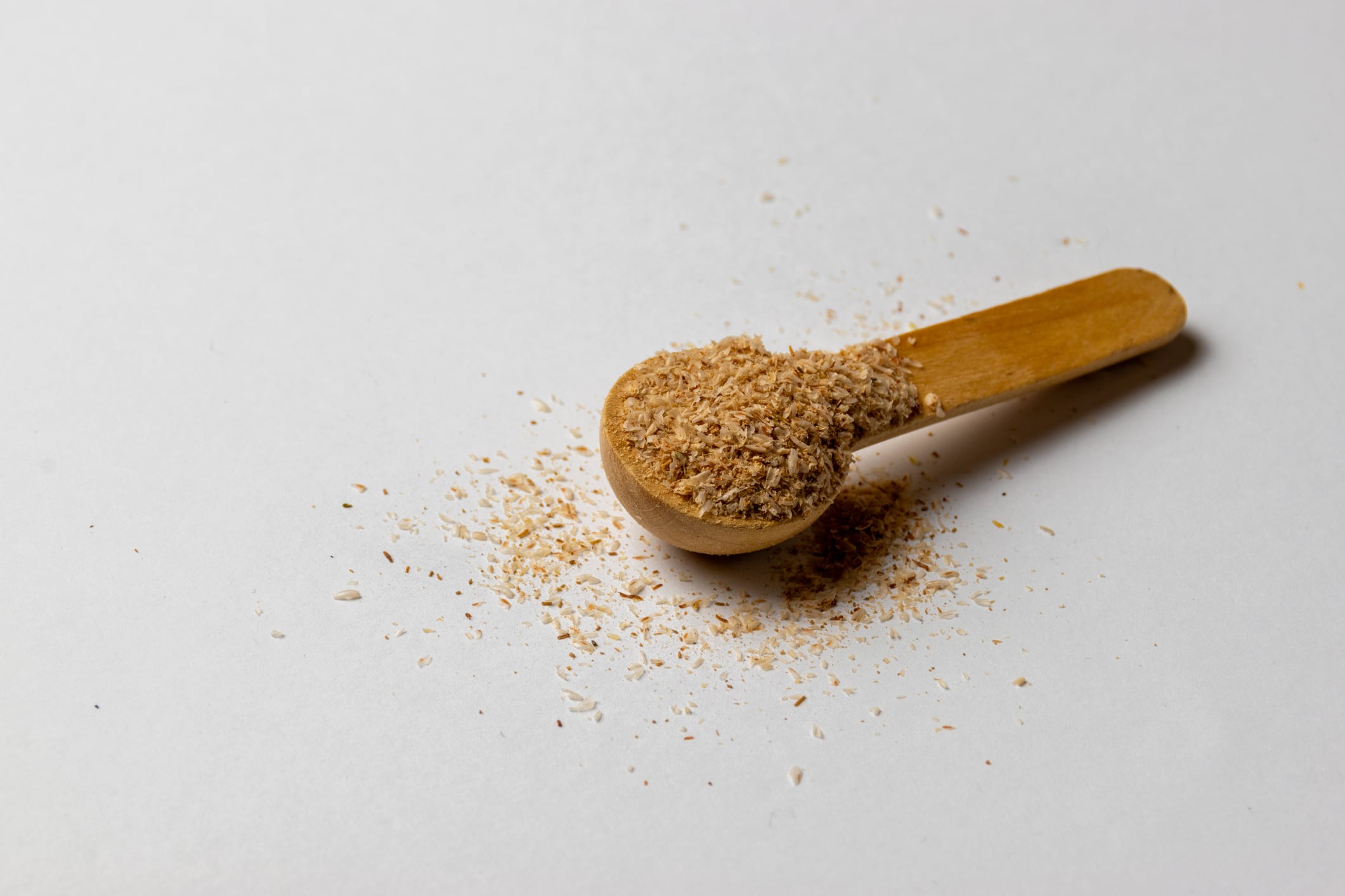 Psyllium husk and wooden spoon