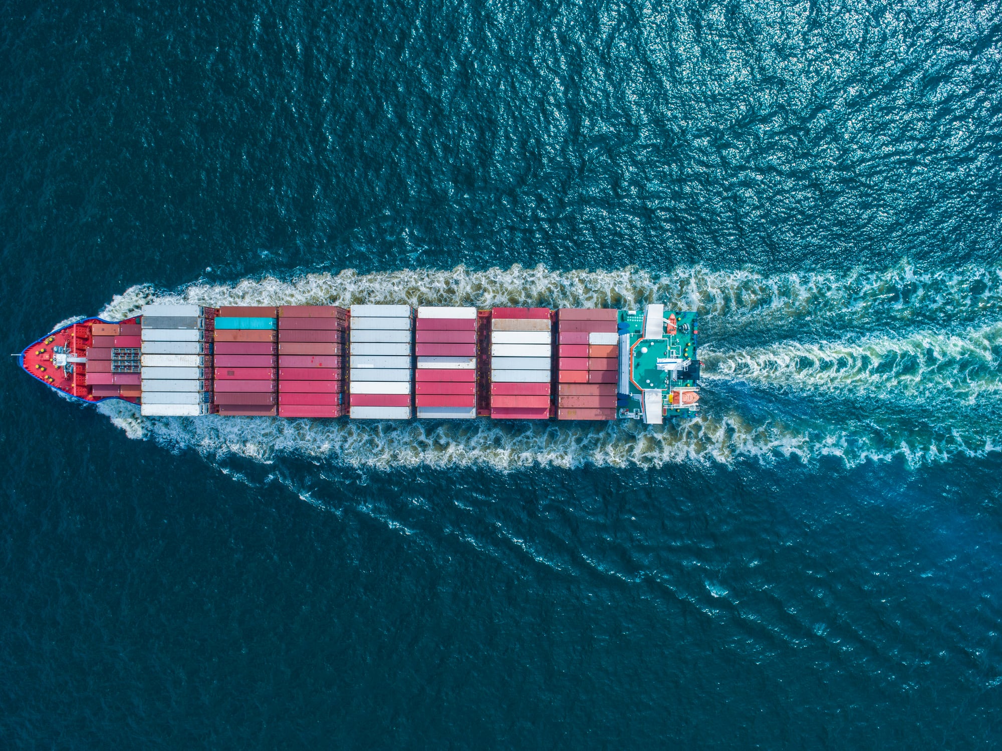 Aerial view of container ship in sea