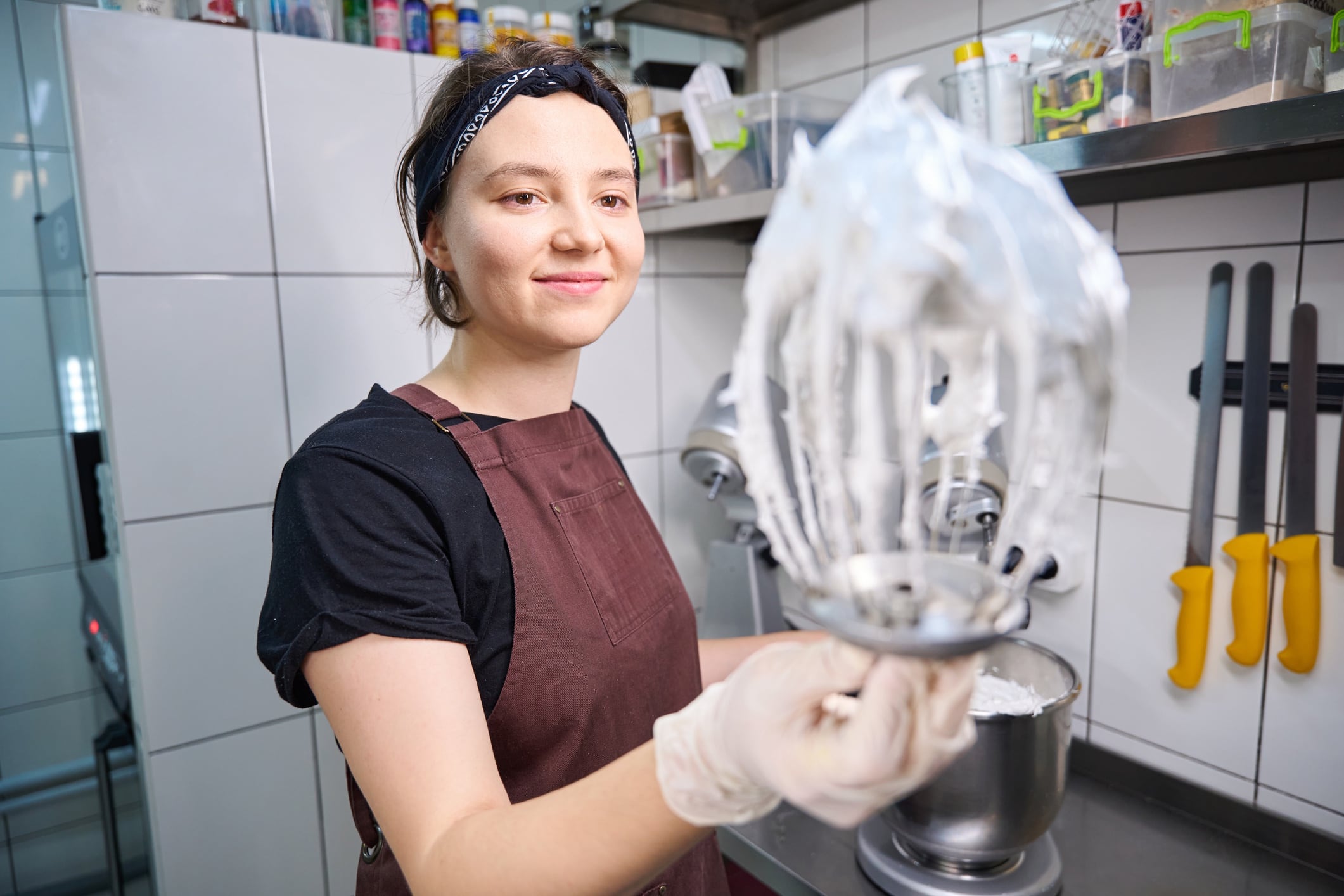 Pastry chef demonstrating whisk with whipped egg whites