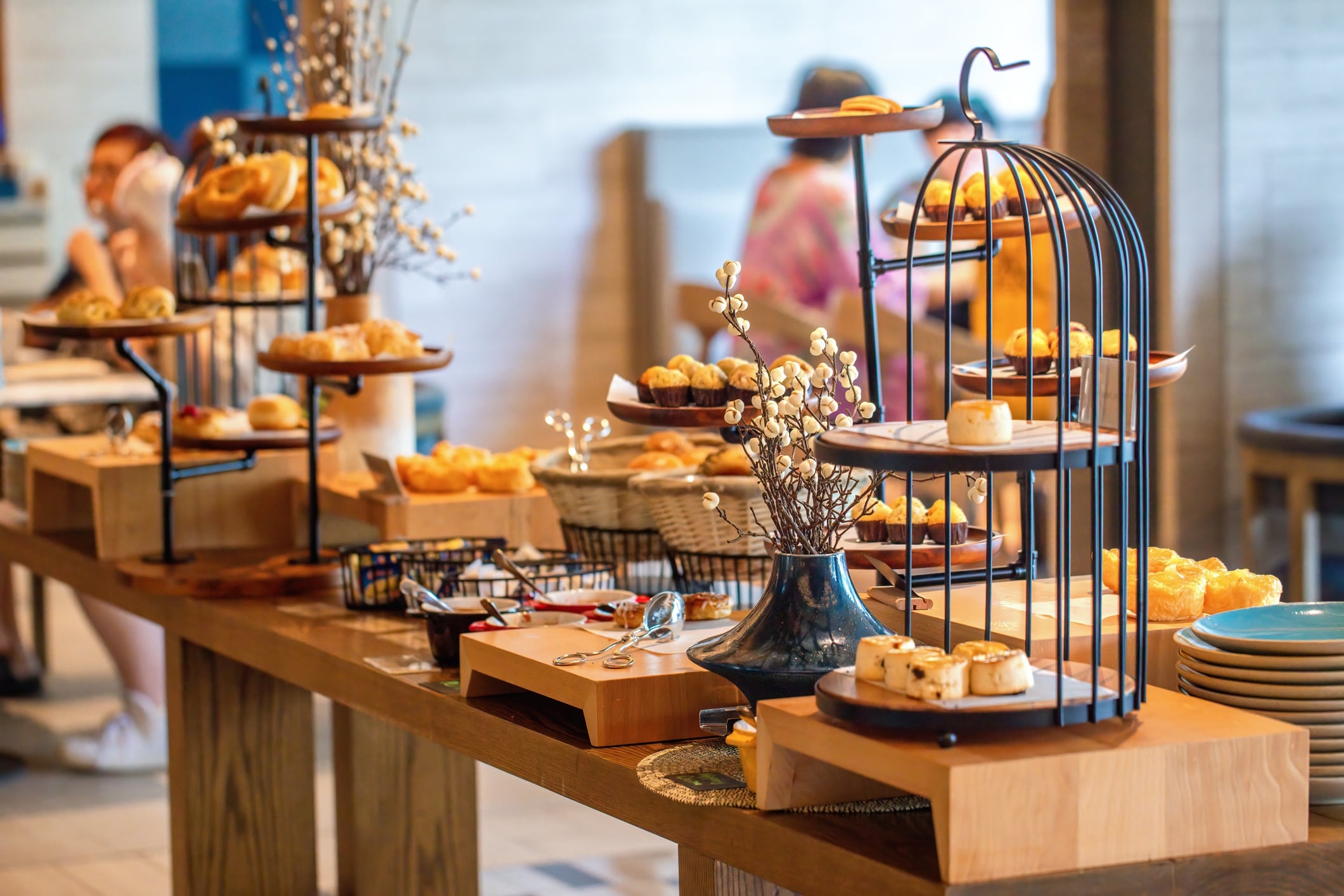 Assorted pastries on display in modern bakery shop. Gourmet and culinary art. molishka1988 GettyImages-