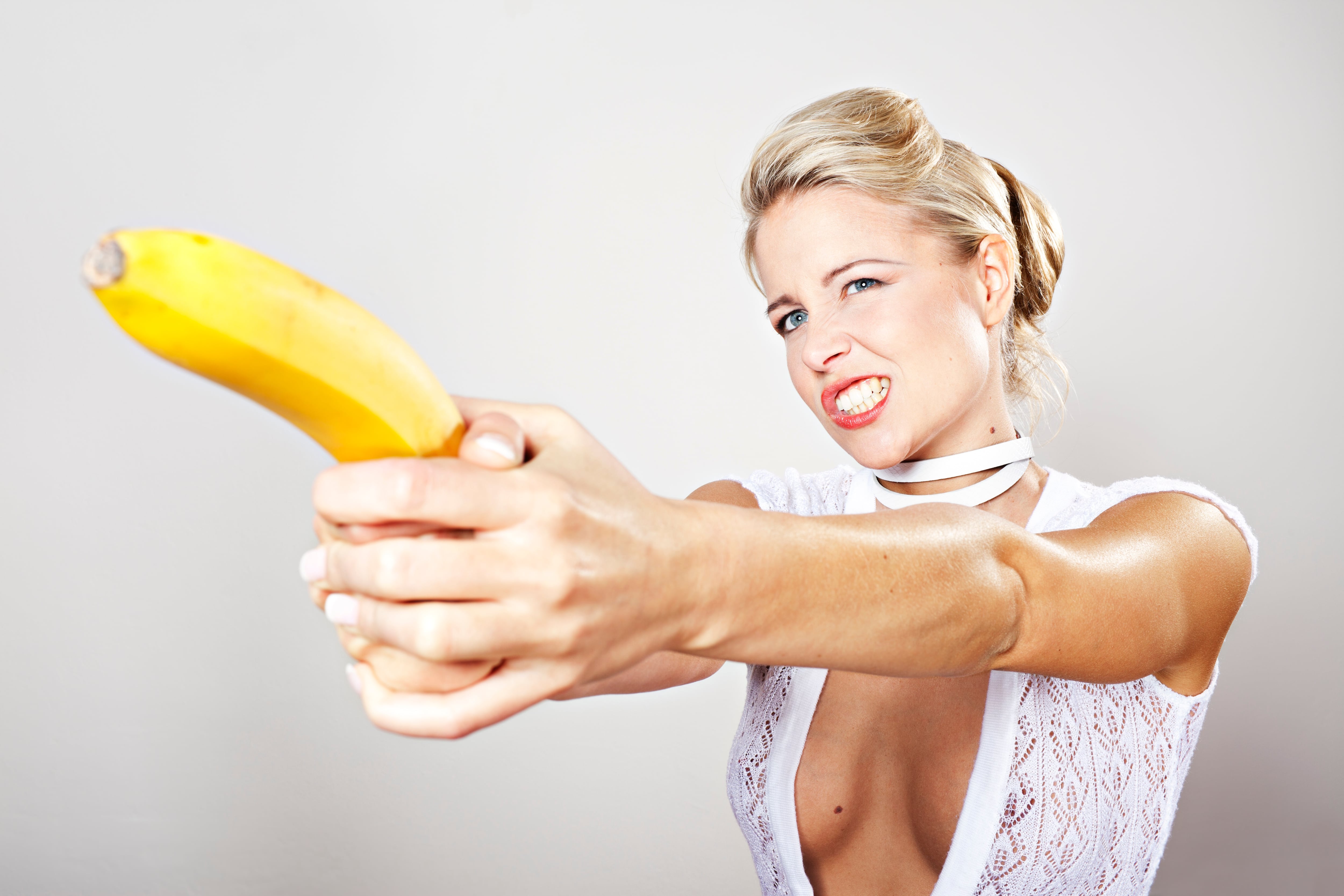 Woman holding banana 'pistol'