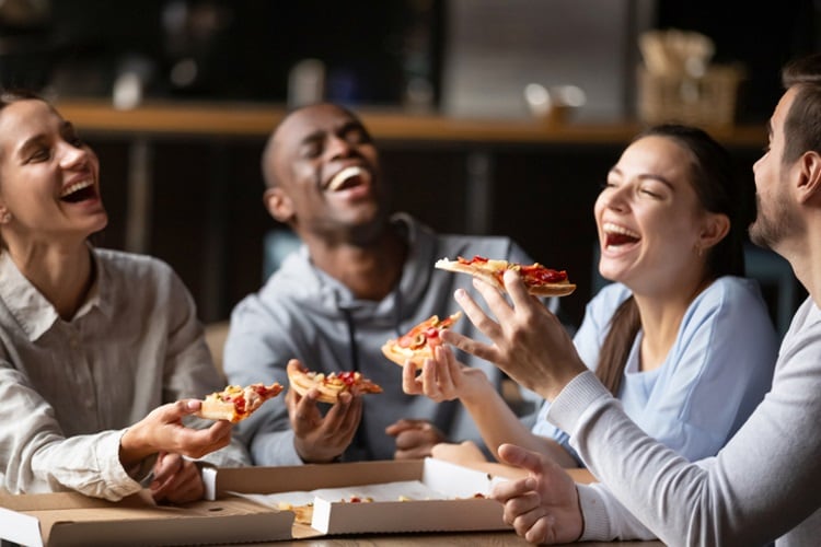 Group of friends bonding over pizza