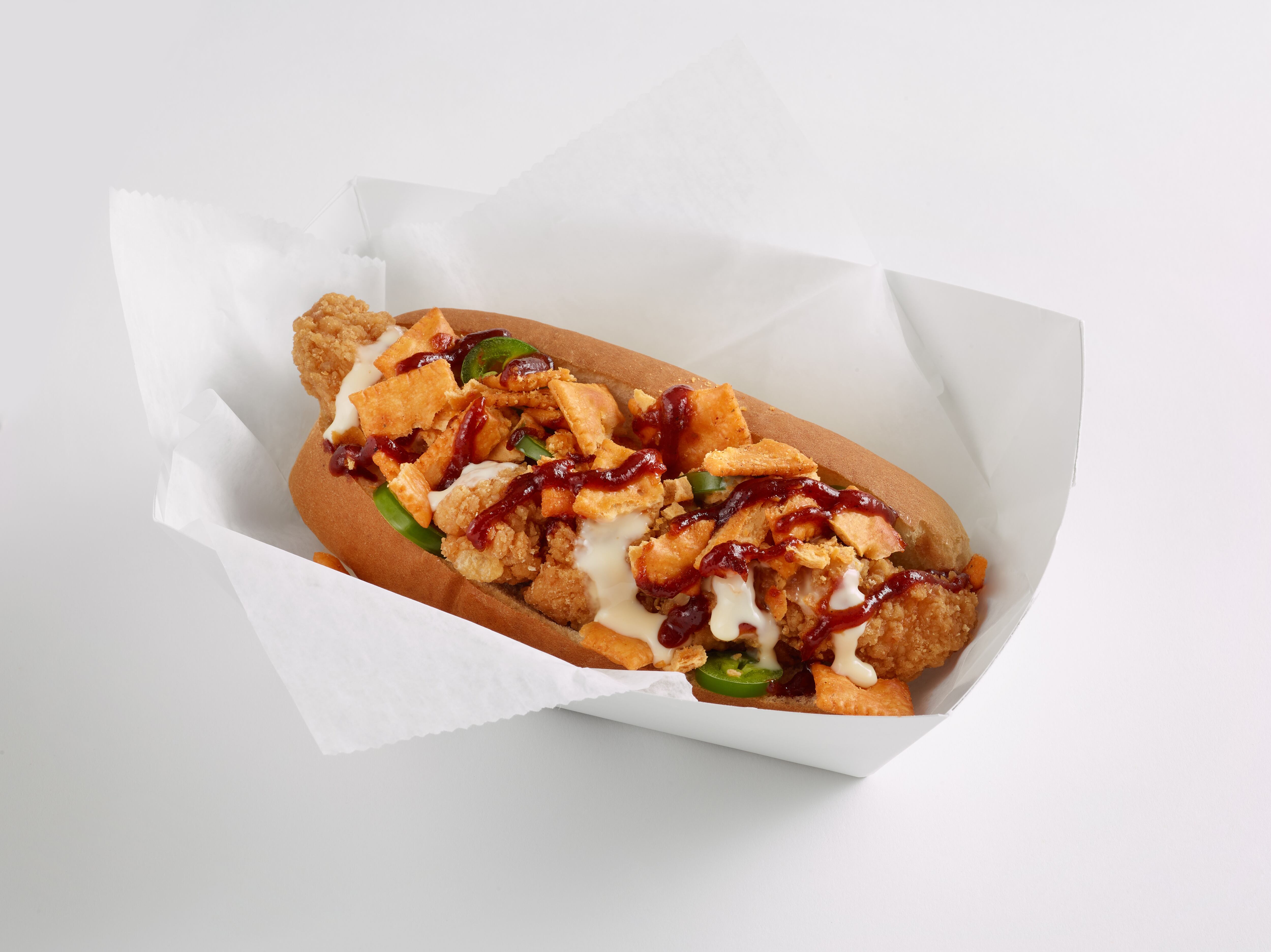 Swicy Cheez-It Bird Dog (crispy chicken tenders topped with beer cheese sauce, jalapeños, Hot & Spicy Cheez-It crackers and roasted raspberry chipotle sauce served in a steak roll).