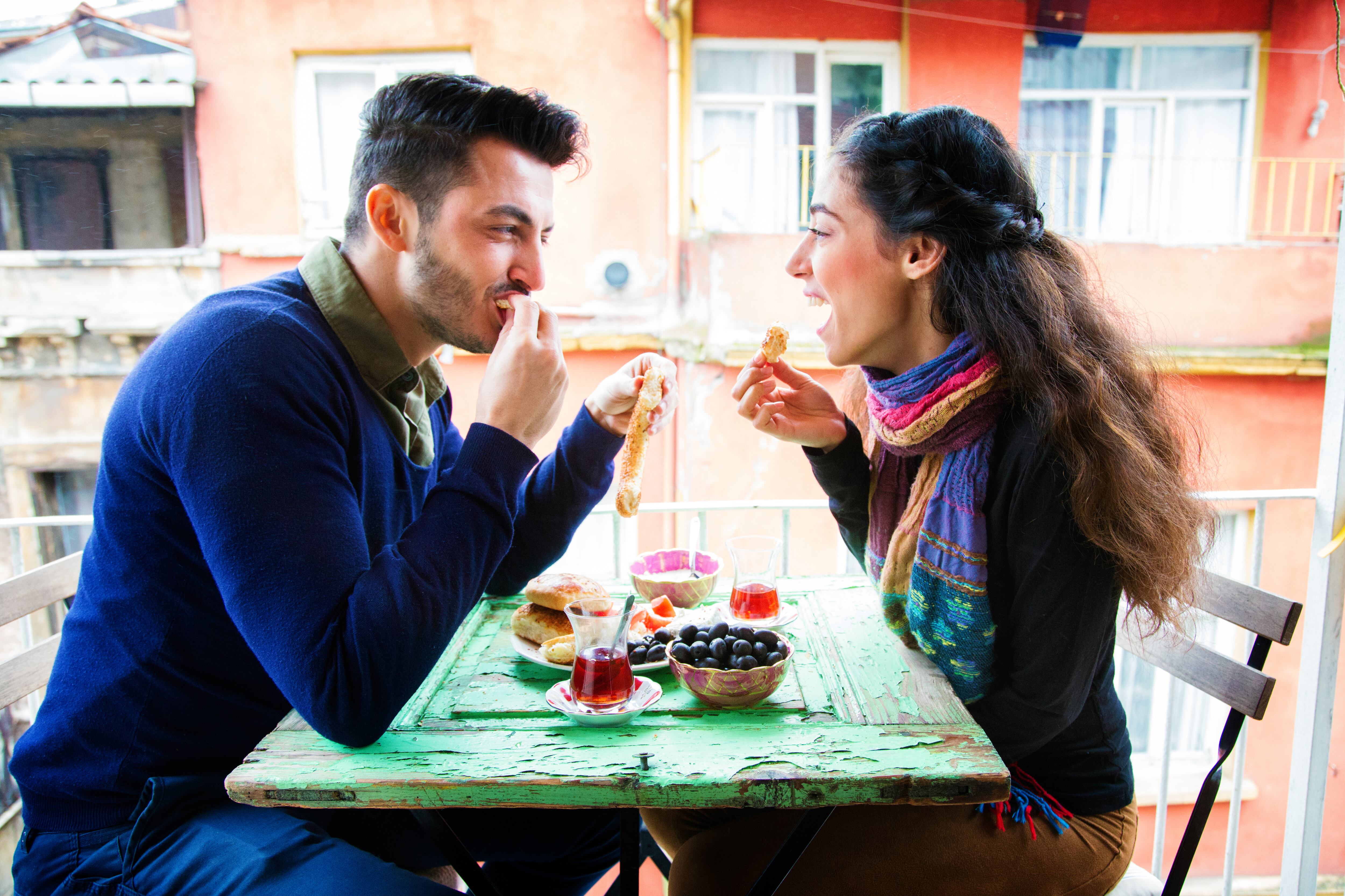 Young Middle Eastern couple enjoying a meal