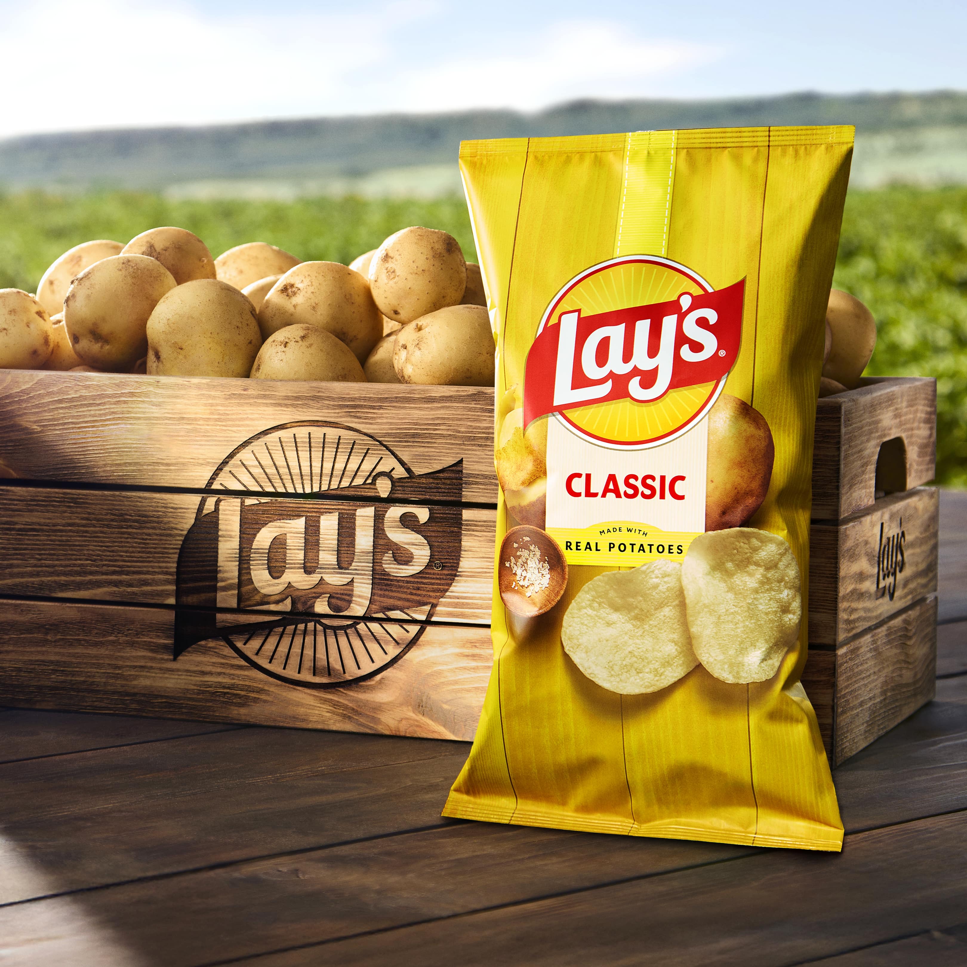 Lay's brand refresh features a prominently displayed potato and chips, the Lay's sun and sun rays.