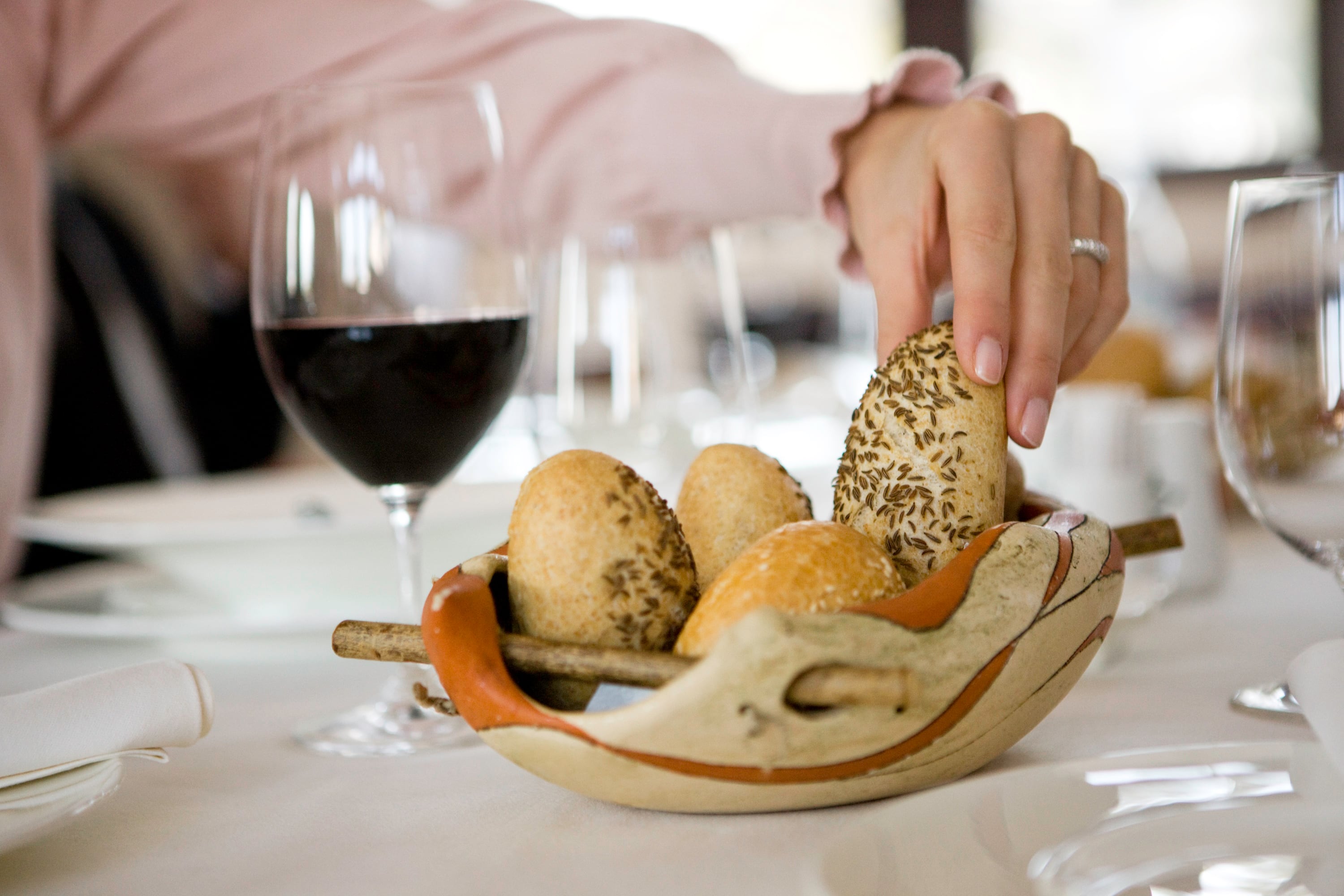 Woman's hand taking bread