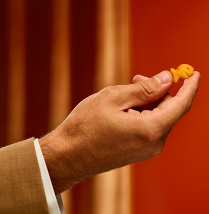 Goldfish-rebrand-hand-holding-cracker.jpg