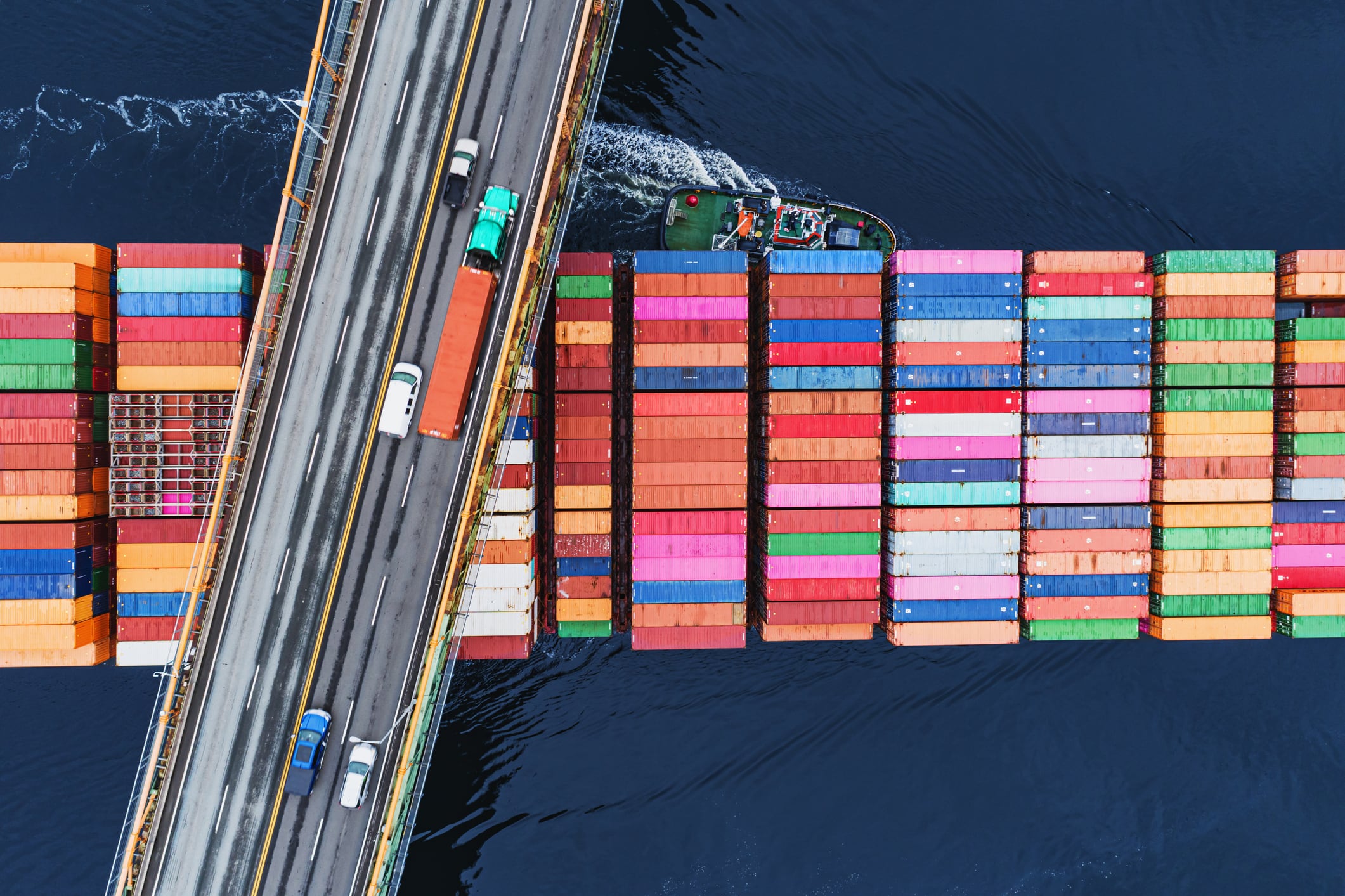 Big food shares up after Donald Trump pauses tariffs. Image: A container ship passes beneath a suspension bridge as it departs for Europe.