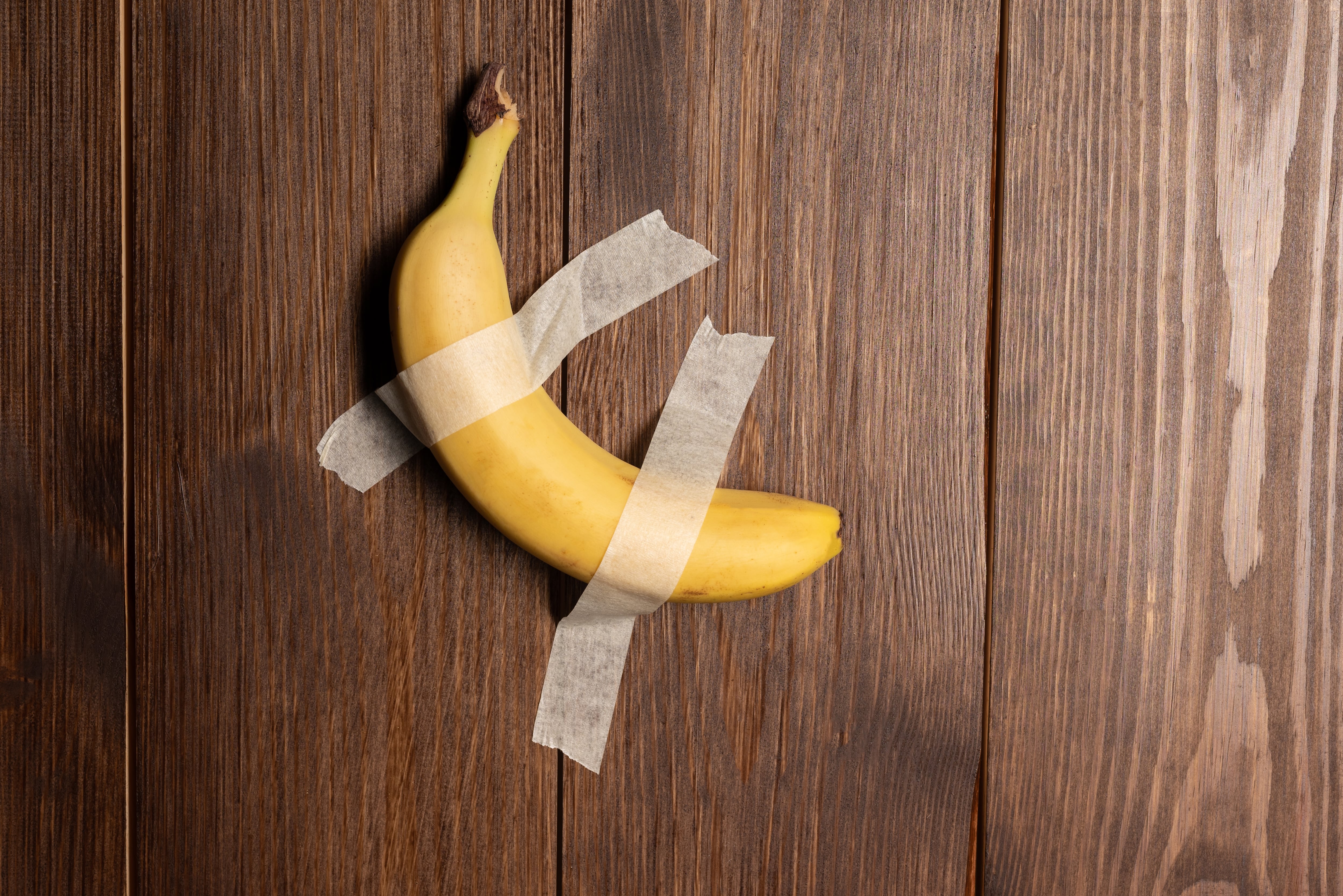 Banana taped to a wall