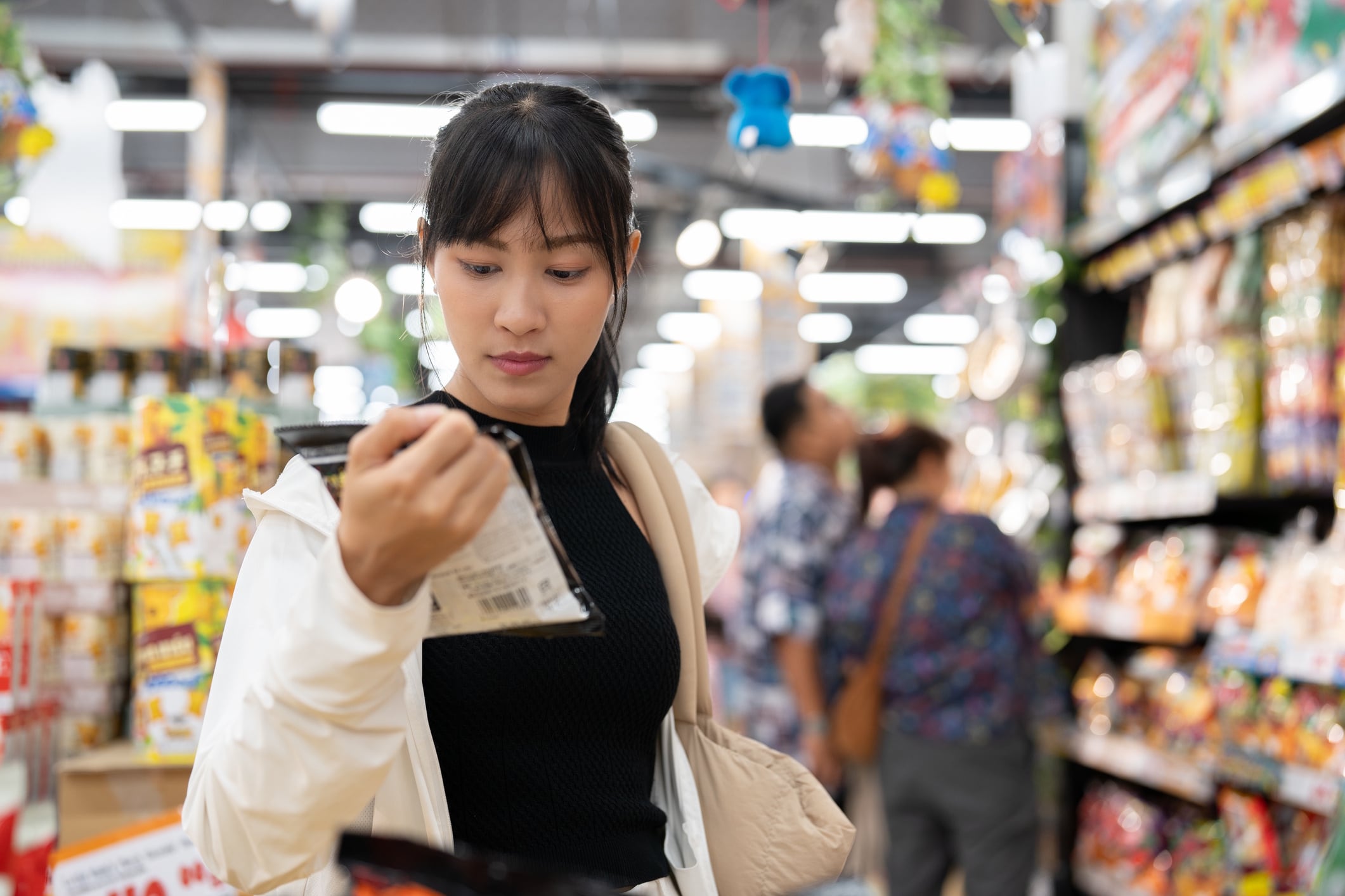 Asian Woman in Happy Mood Shopping for Fresh Goods at the Supermarket Papatsorn Khunsaard GettyImages