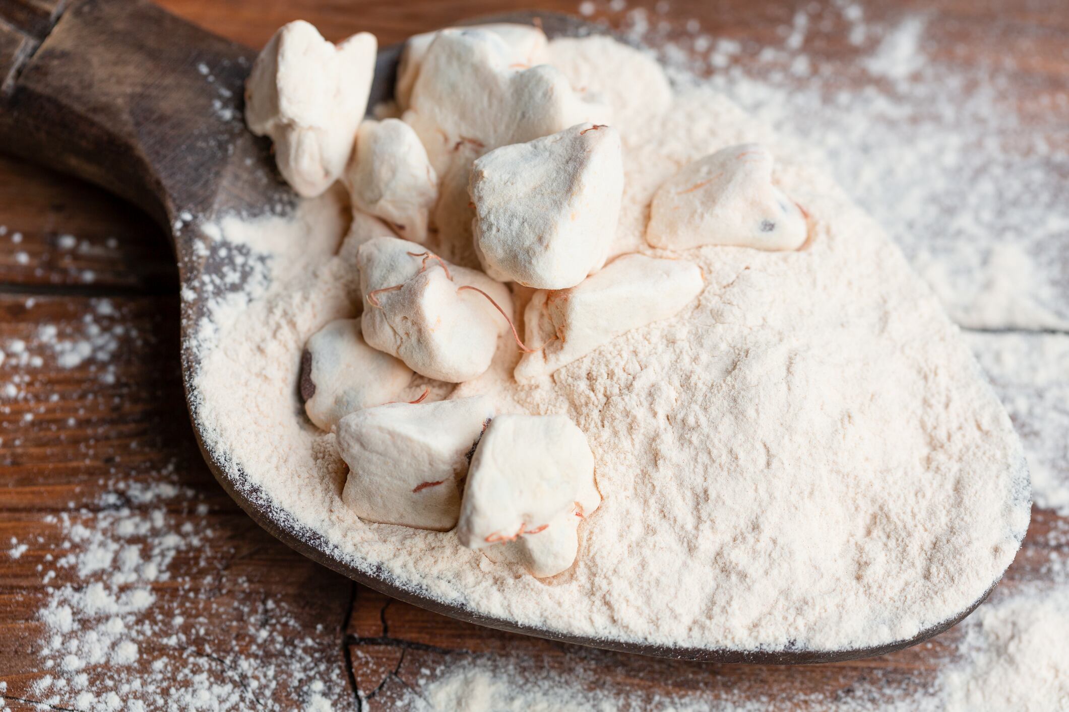 baobab fruit and powder on wooden spoon close up