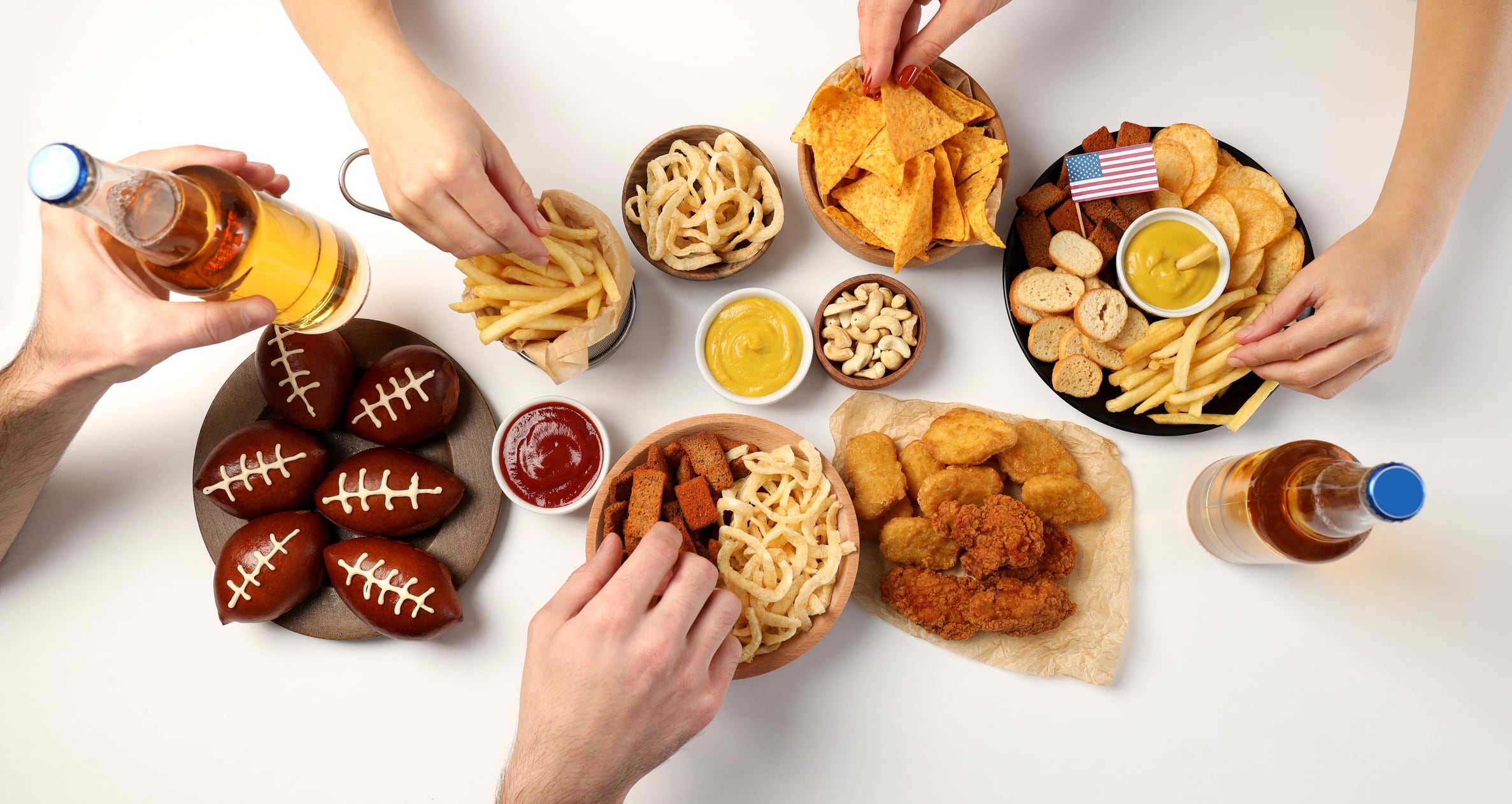 Concept of Super bowl snacks on white background GettyImages-2216006210 Atlas Studio