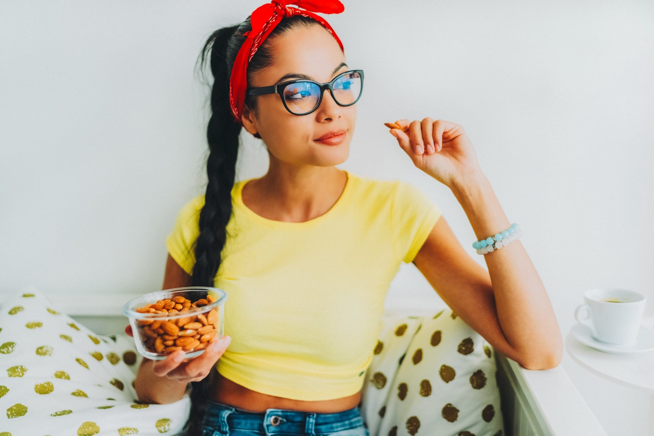 Young woman eating nuts
