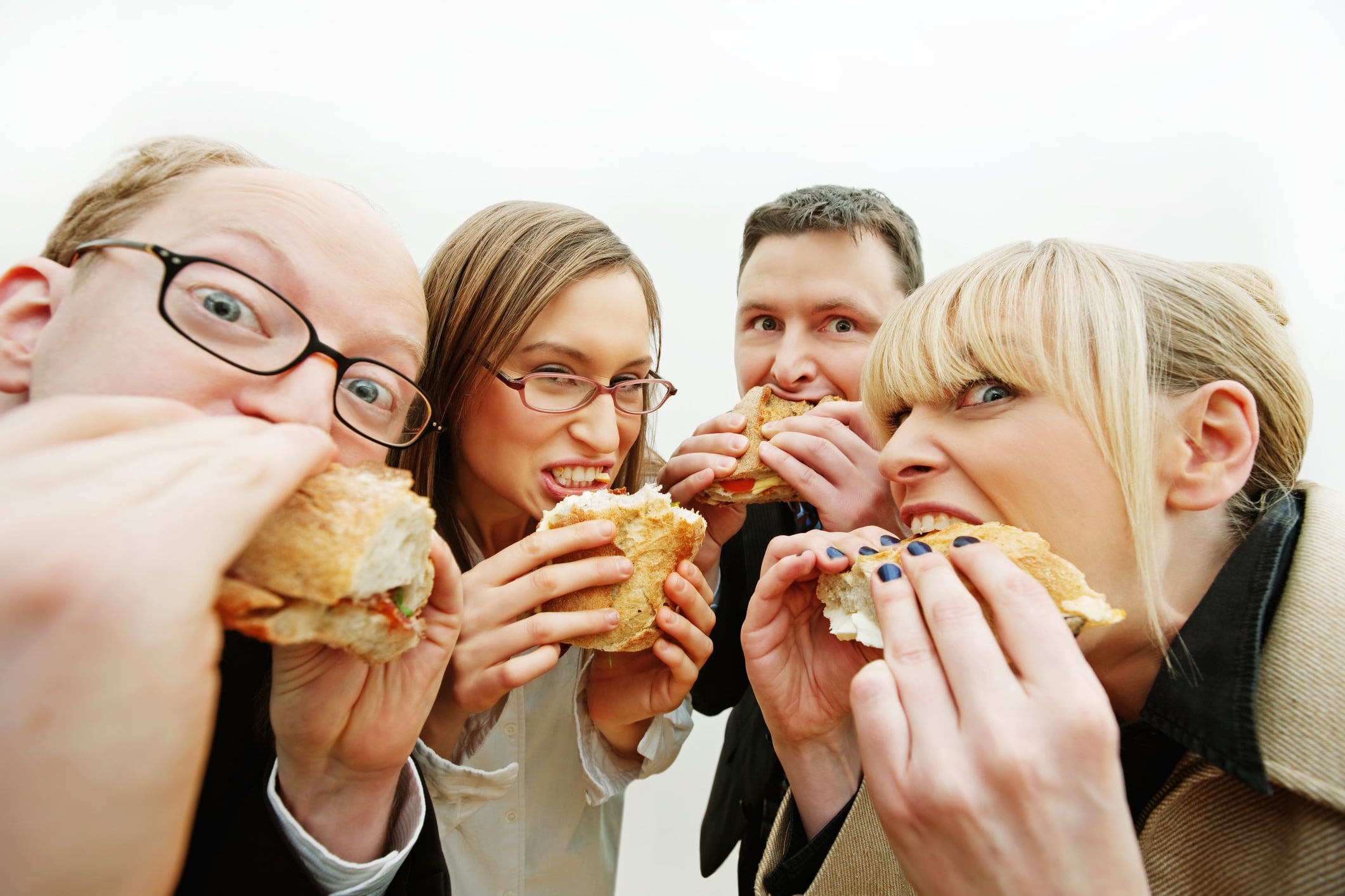 Office workers eating baguettes