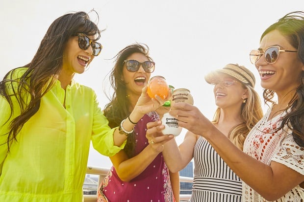 Young people drinking BuzzBallz RTD cocktails