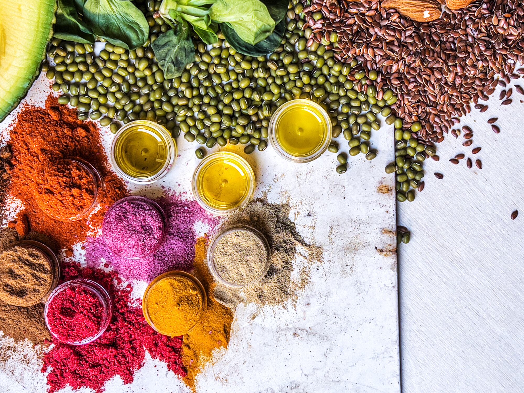 Multi colored vegetables, fruits, legumes and spices on wooden table Nathalie Pellenkoft GettyImages-2204376850.jpg