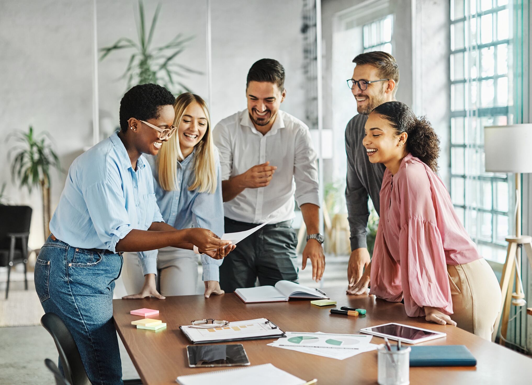 Business meeting businesswoman woman office portrait job career happy businessman teamwork colleague businessperson startup creative student education project Paperkites GettyImages