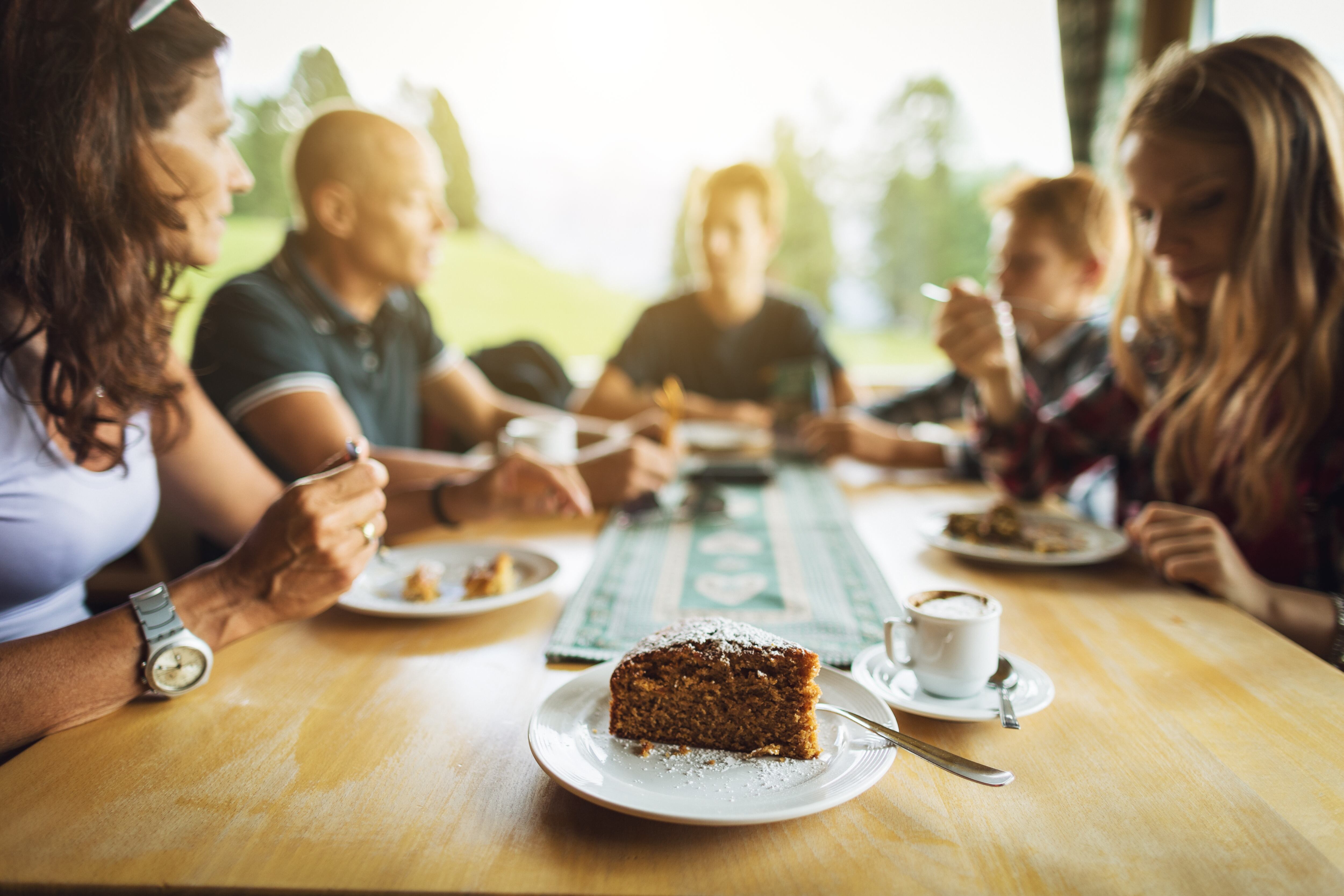 Group of friends meeting for coffee and cake