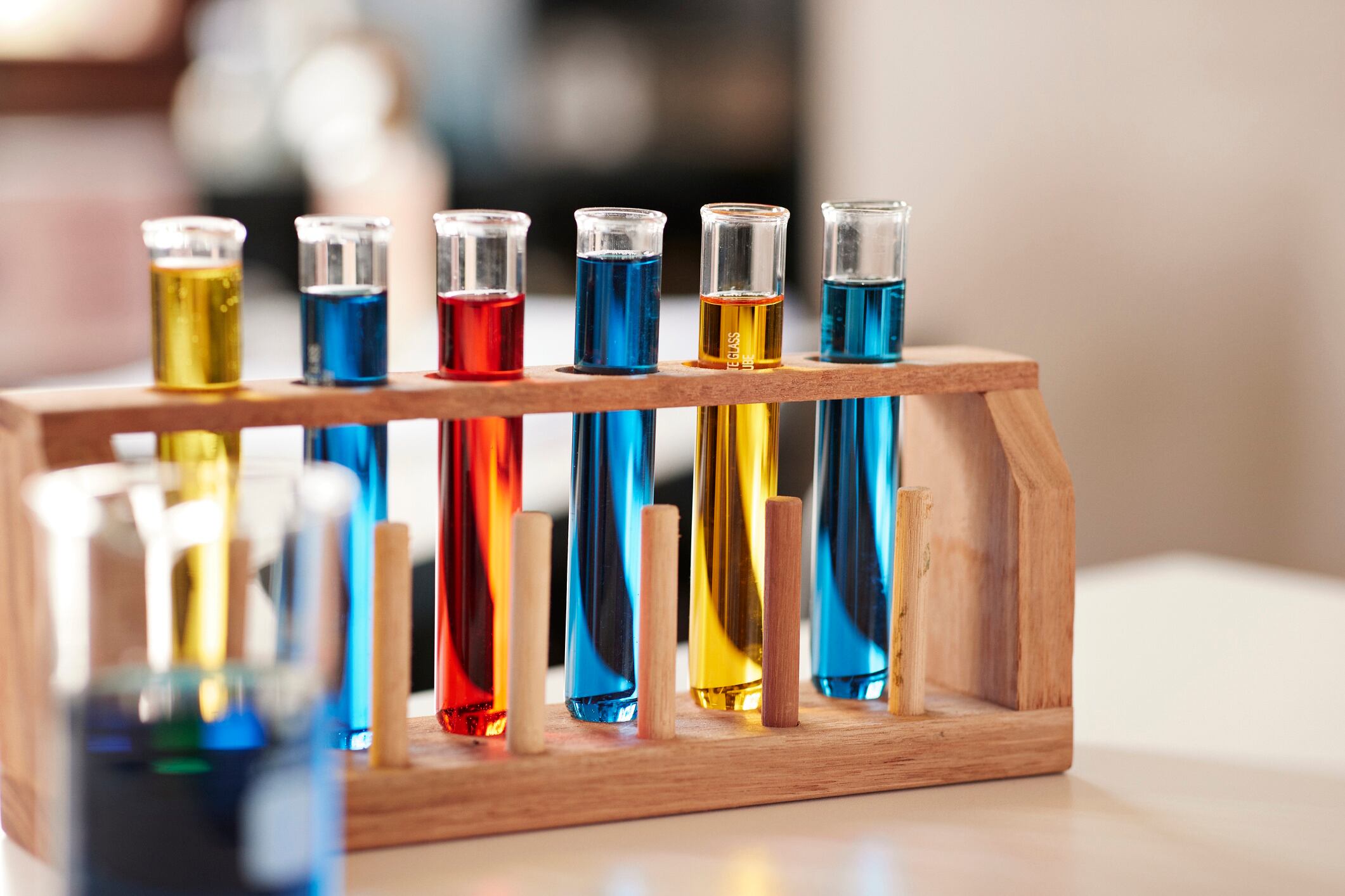 Test tube rack with colorful chemicals in laboratory Klaus Vedfelt GettyImages