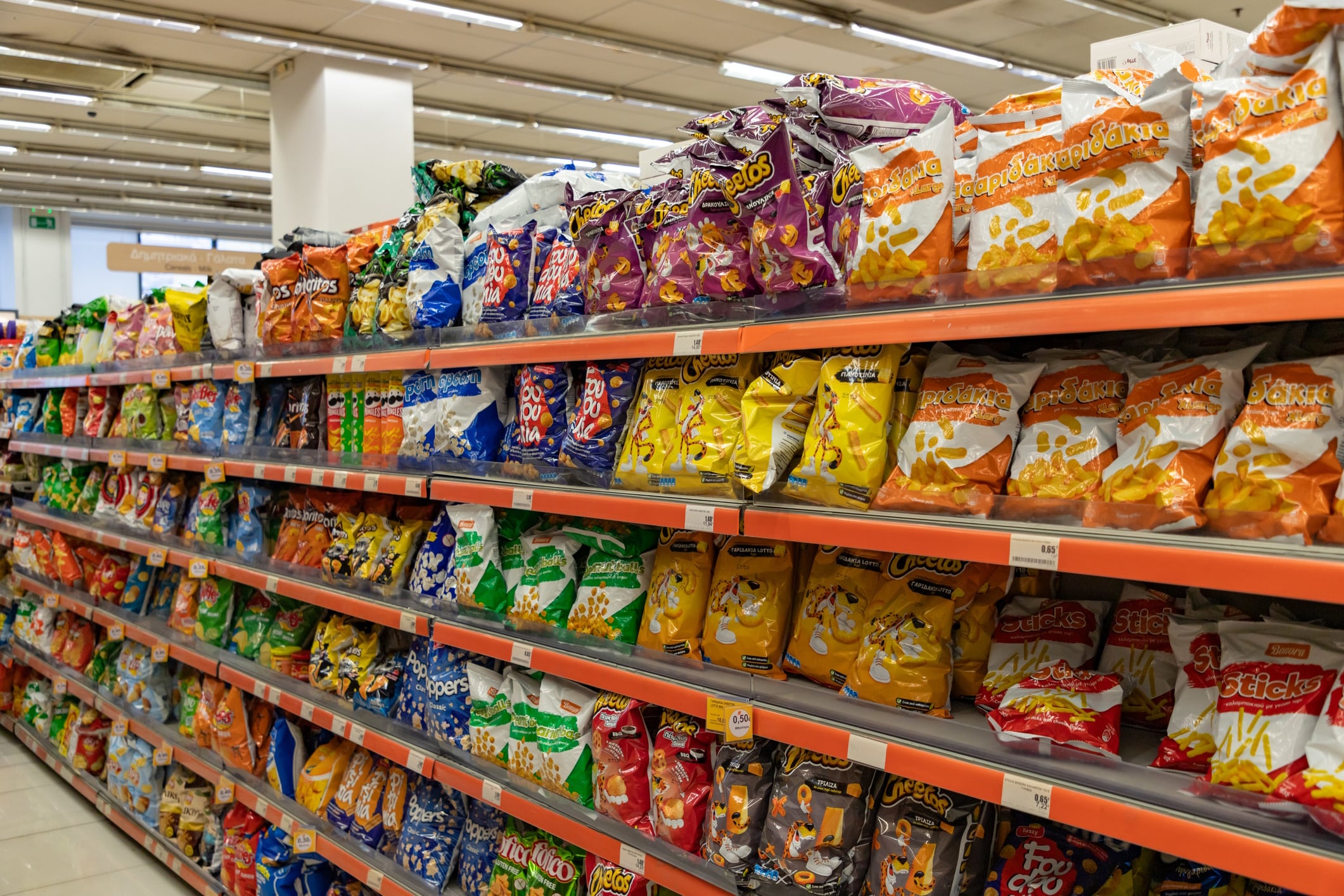 Snacks and chips on supermarket shelf