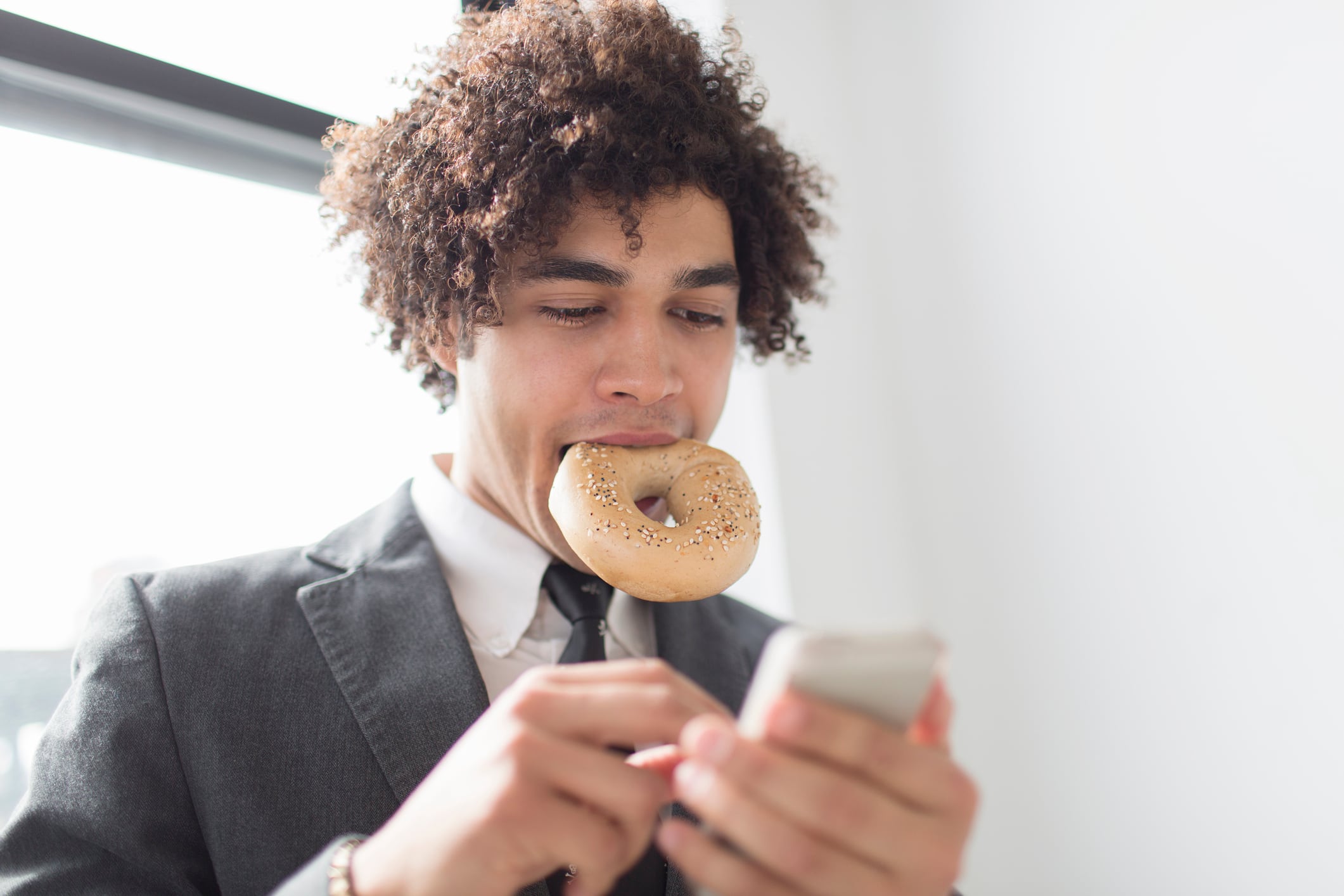 Man eating bagel