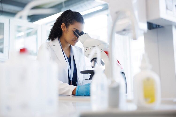 Scientist-at-microsope-Solskin.jpg