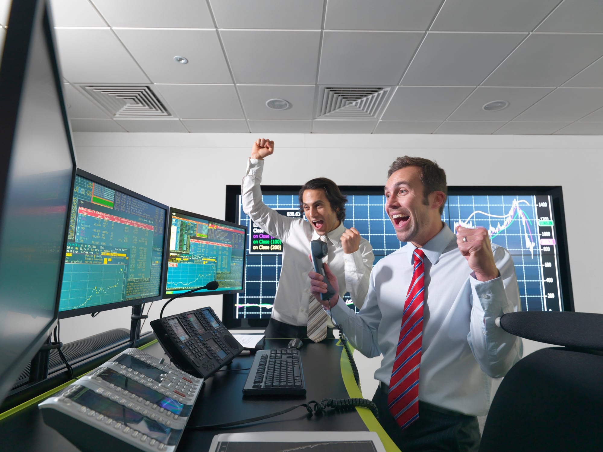 Successful financial trader and screens