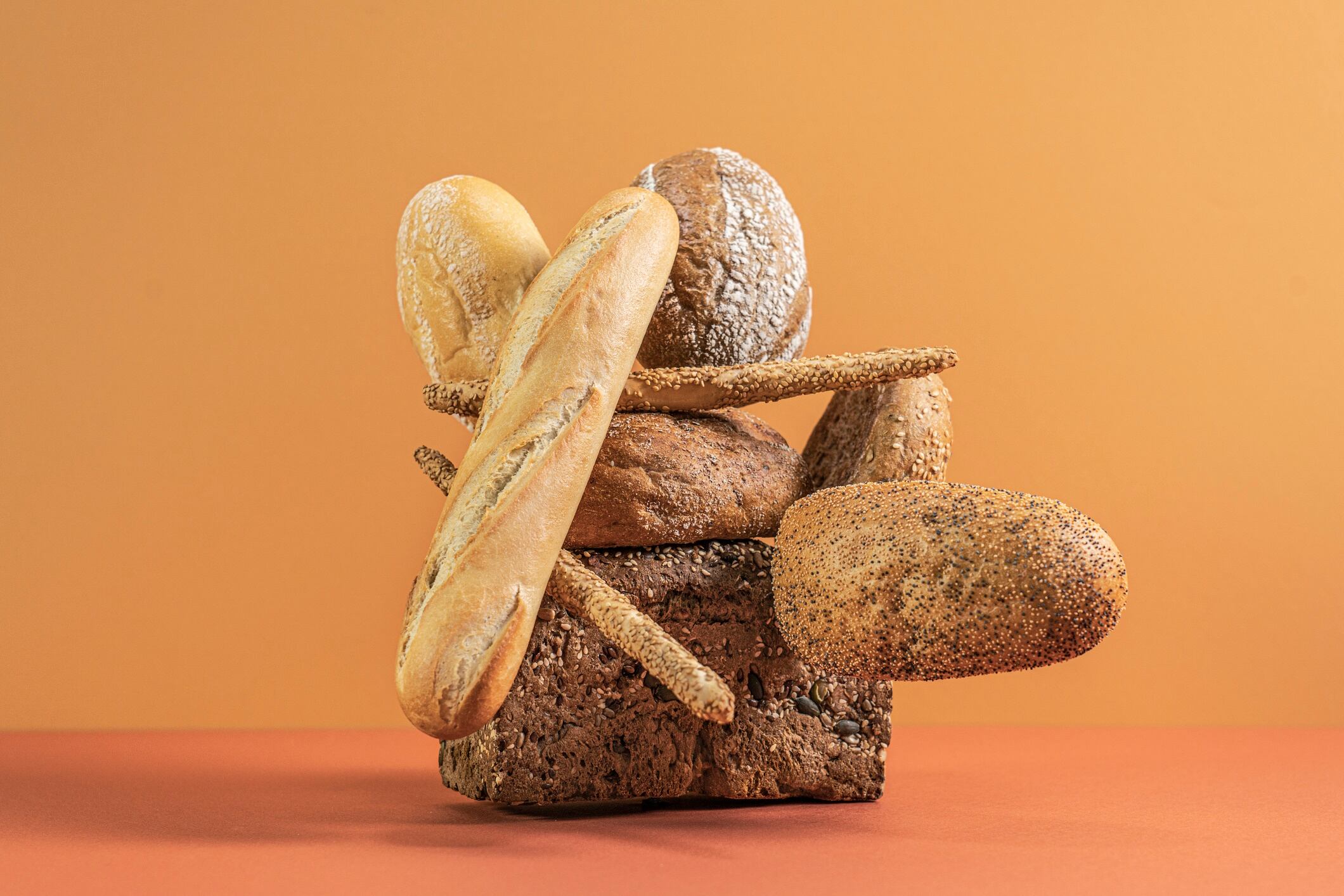 A lot of bread loafs stacked on top of each other