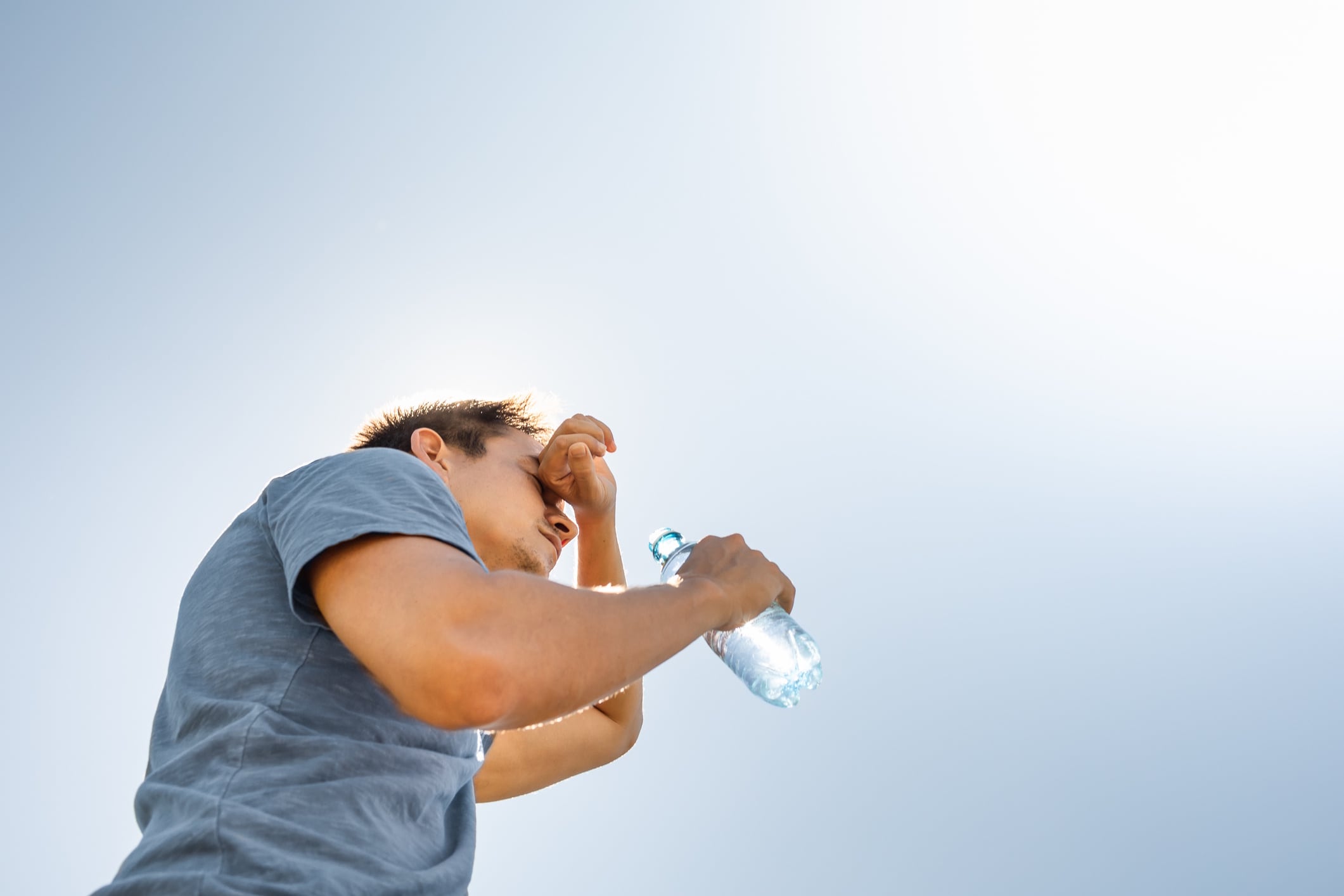 Man drinking water in extreme heat kieferpix GettyImages