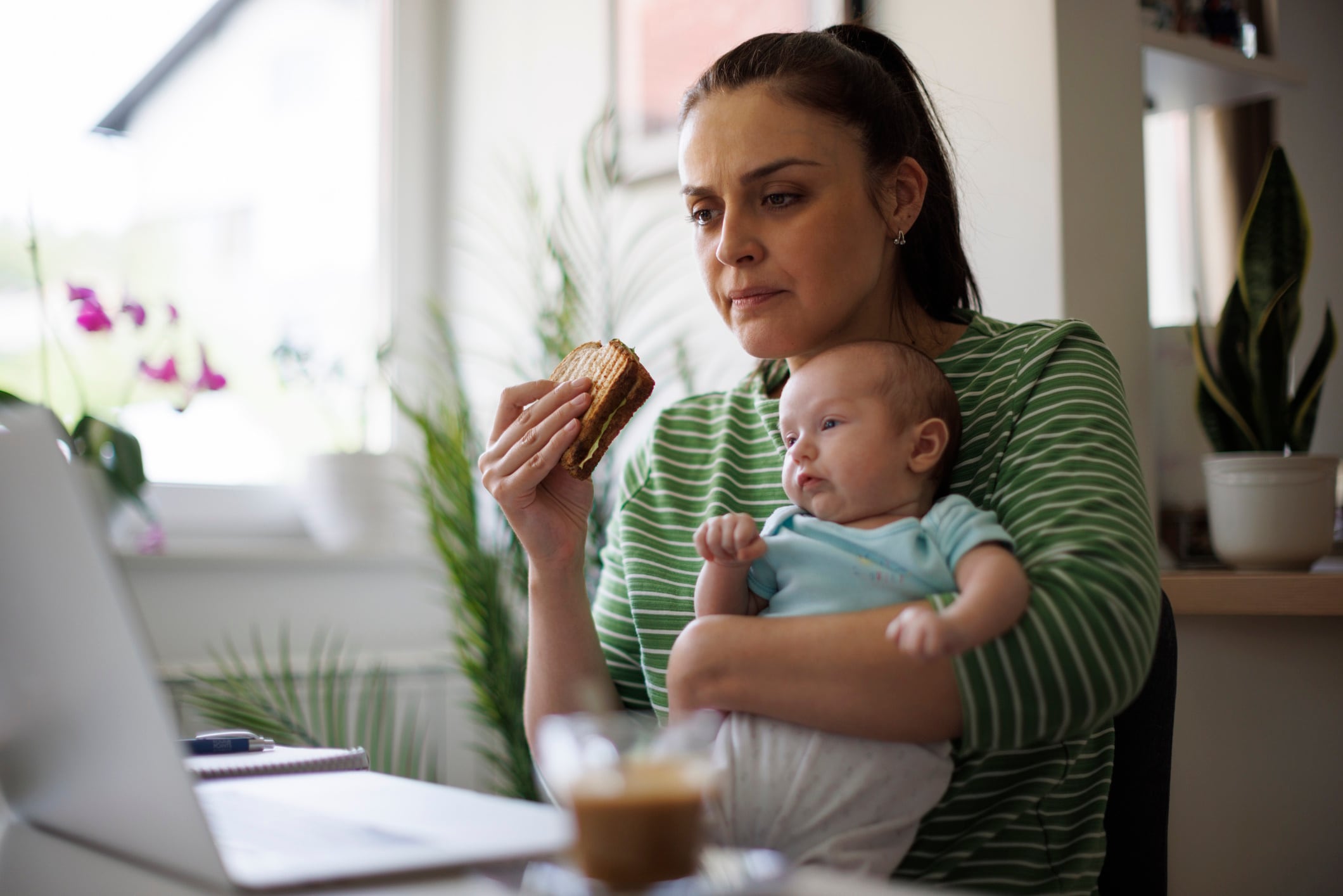 Mother working at home office