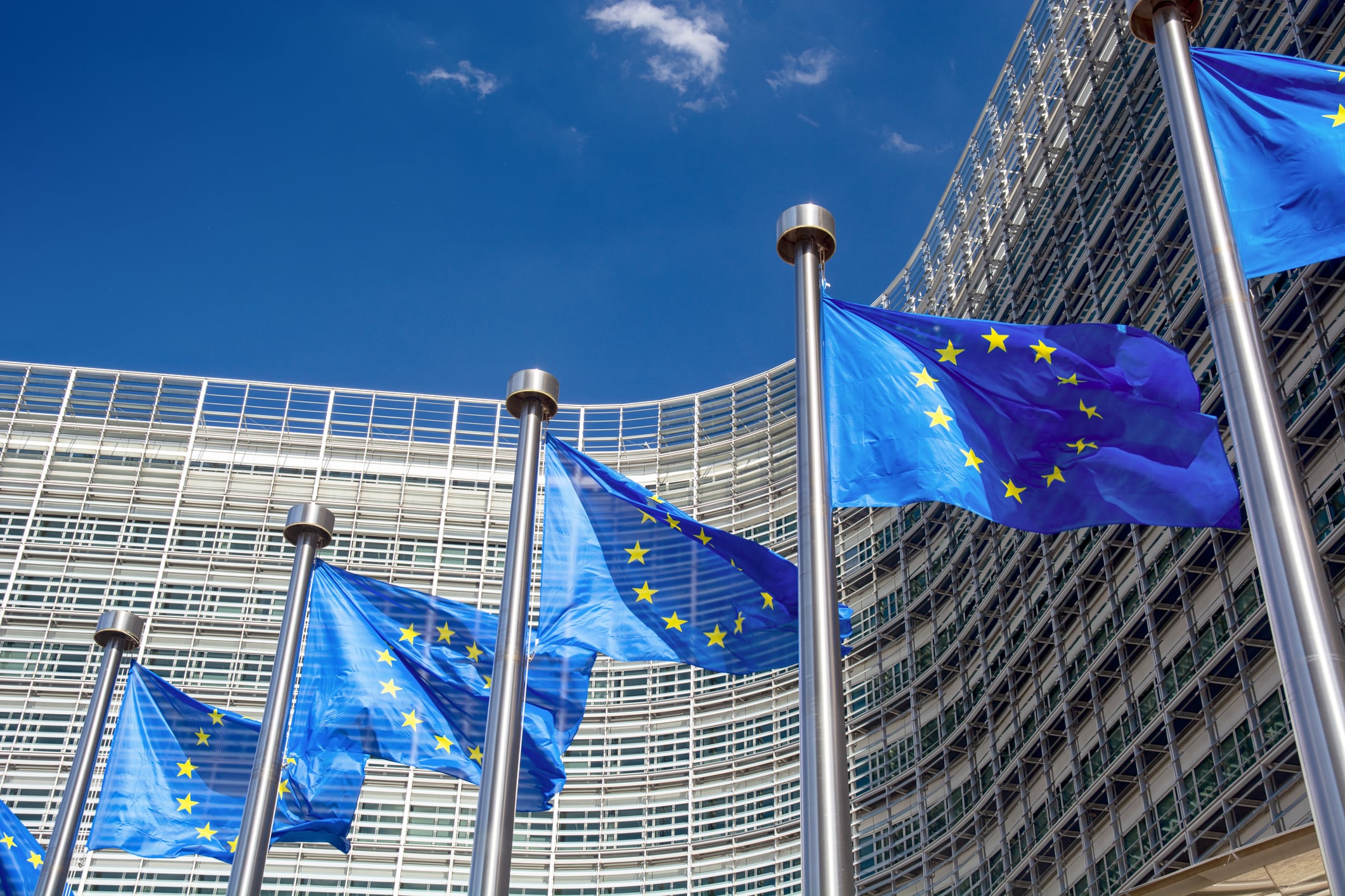 EU flags in front of the Berlaymont building, headquarters of the European Commission in Brussels, Belgium