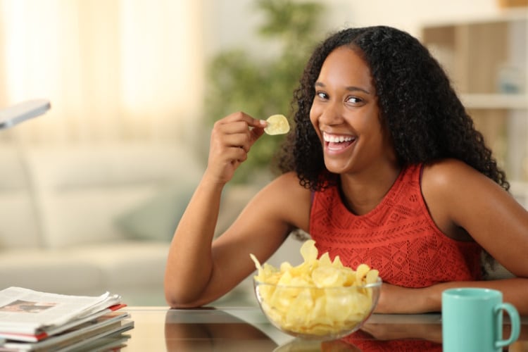 Black-South-African-woman-eating-potato-chips-Getty.jpg