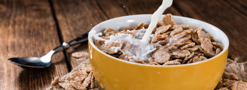 Pouring milk into cereal bowl