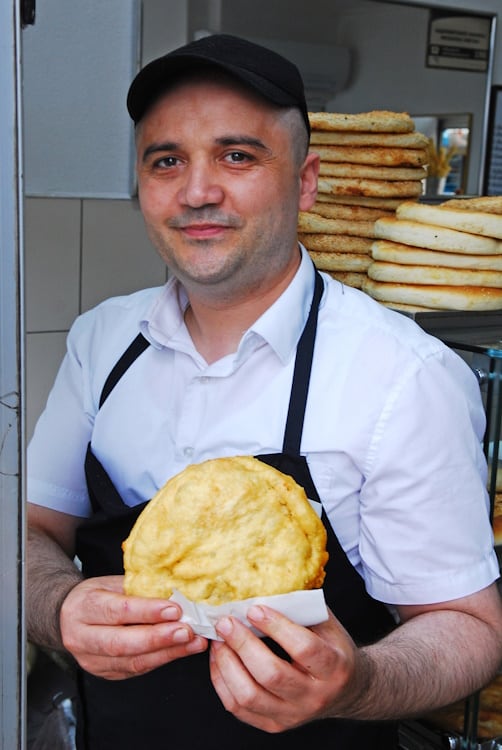 A Turkish baker shows off his handmade bazlama