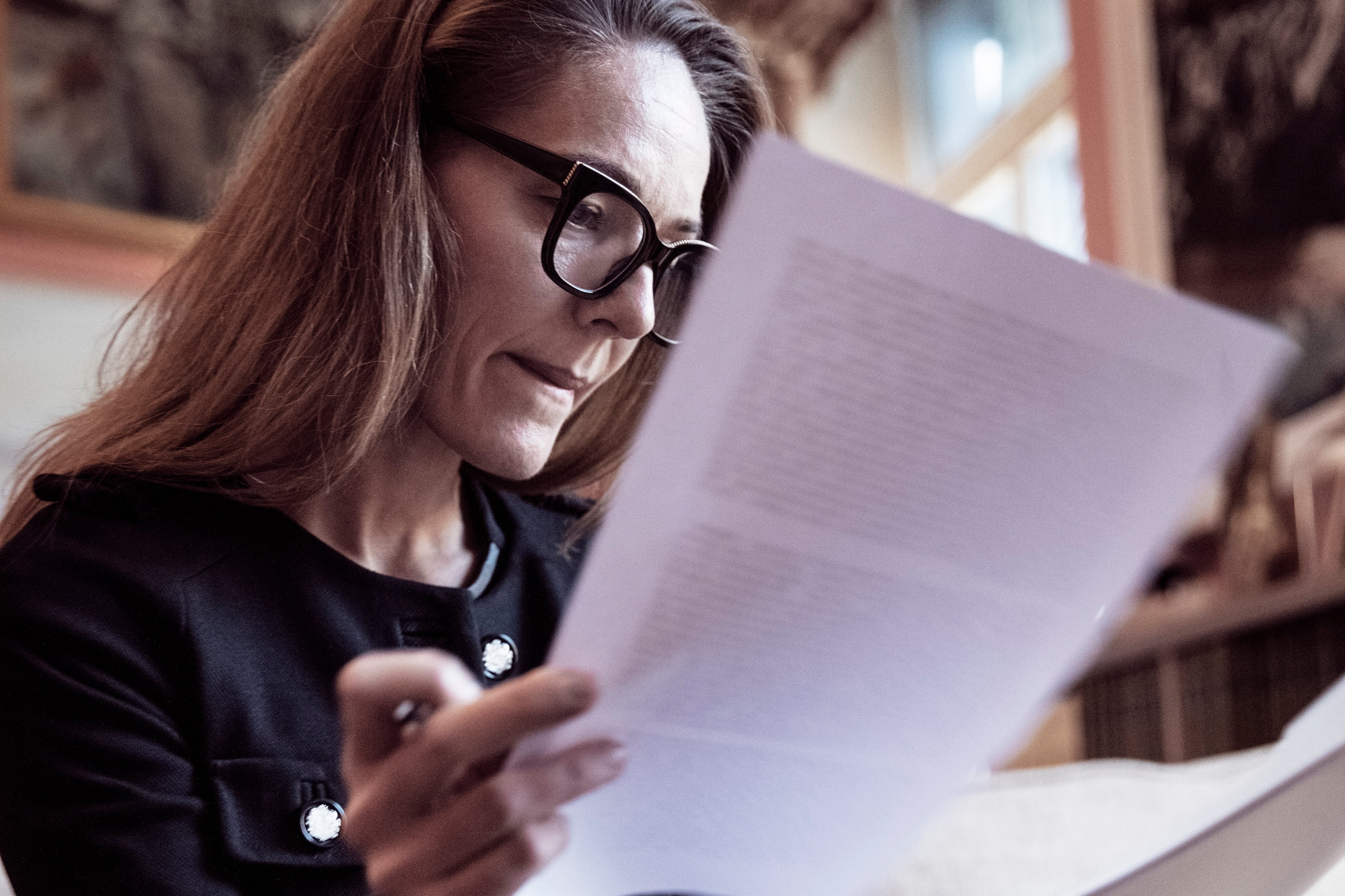 Woman looking over legal document