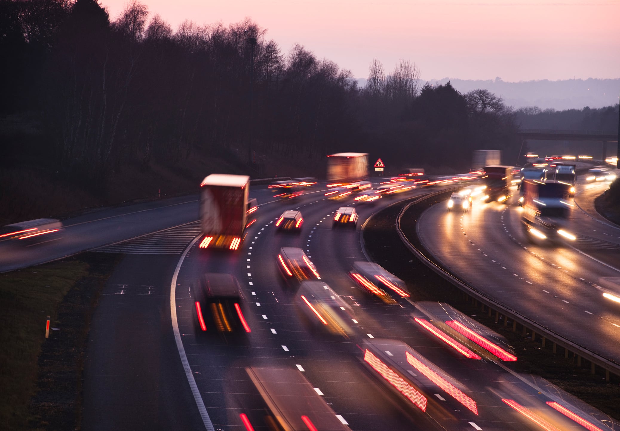 Busy traffic looking west at dusk on the M42 Motorway. Shot from Junction 3, the A435 junction, just south of Birmingham.