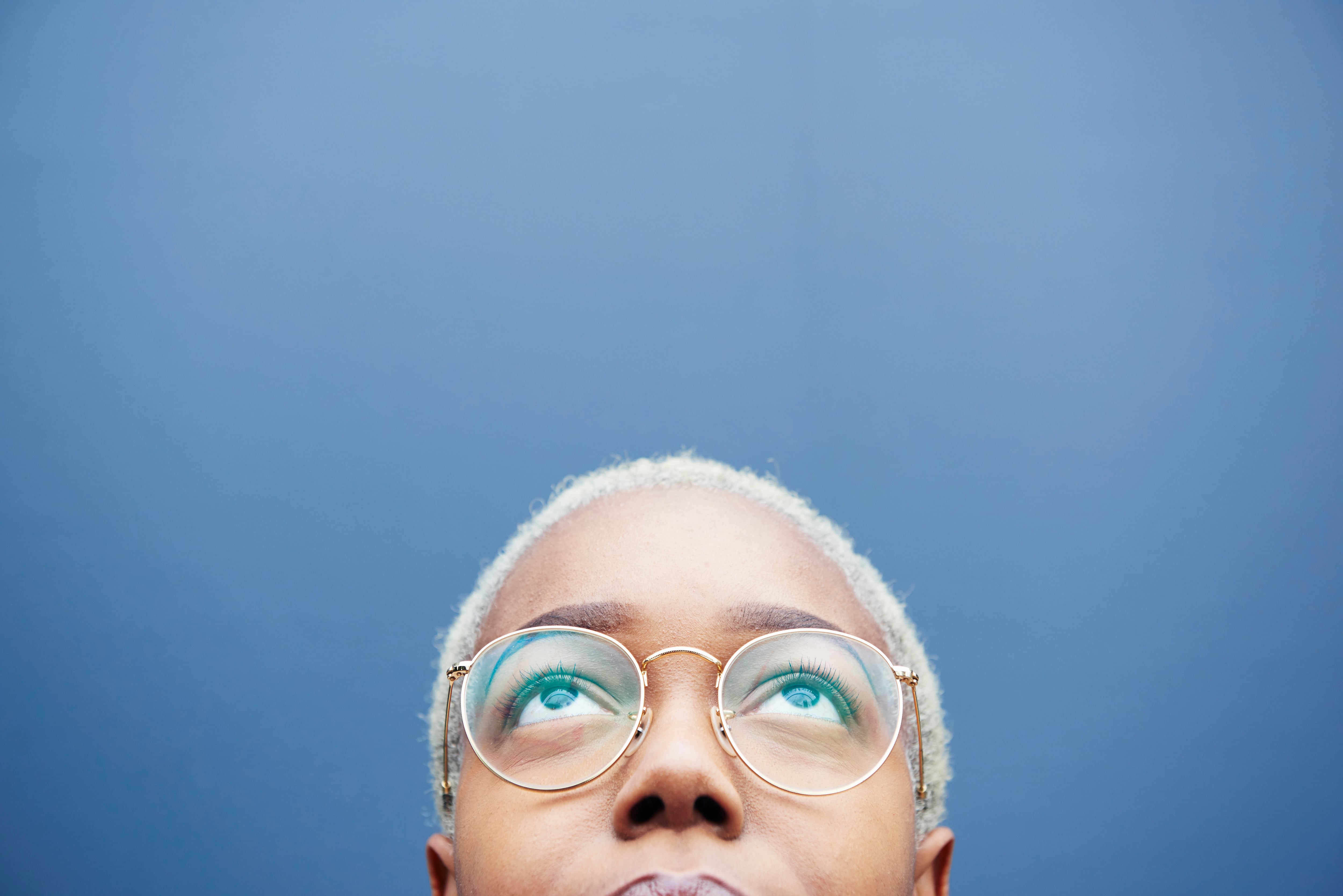 Close up of young woman looking up