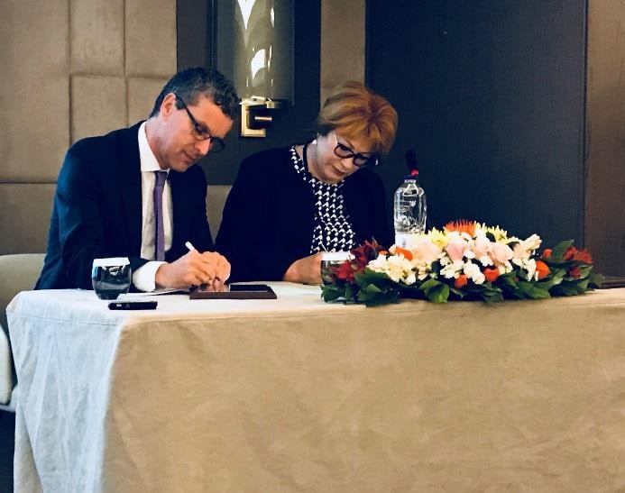 Johan-Sanders-and-Tatiana-Savenkova-signing-cooperative-agreement.jpg