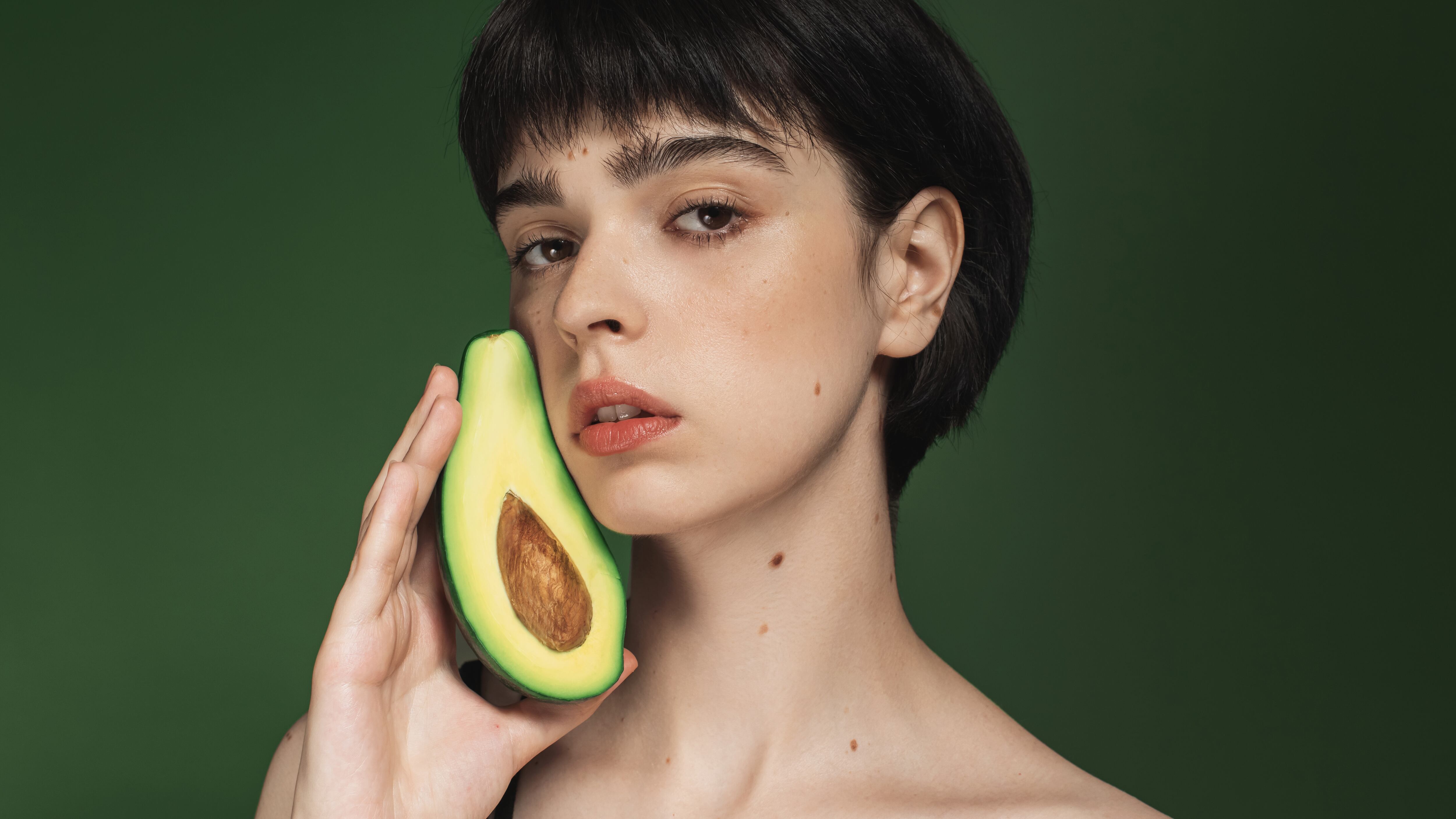 Woman with avocado