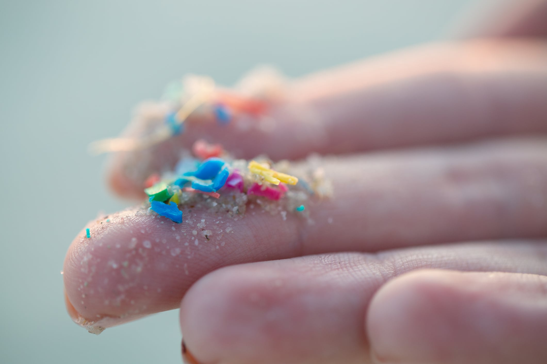 Hand with microplastics