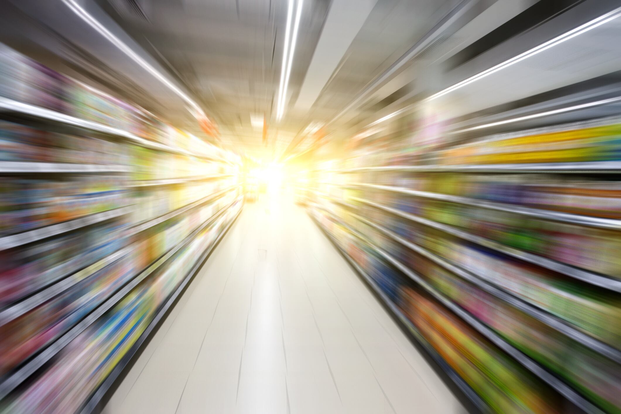 Supermarket aisle with light at the end.