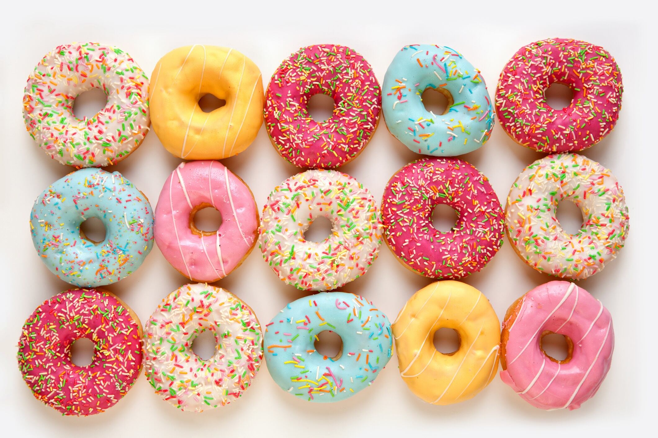Colourful doughnuts isolated on white background.