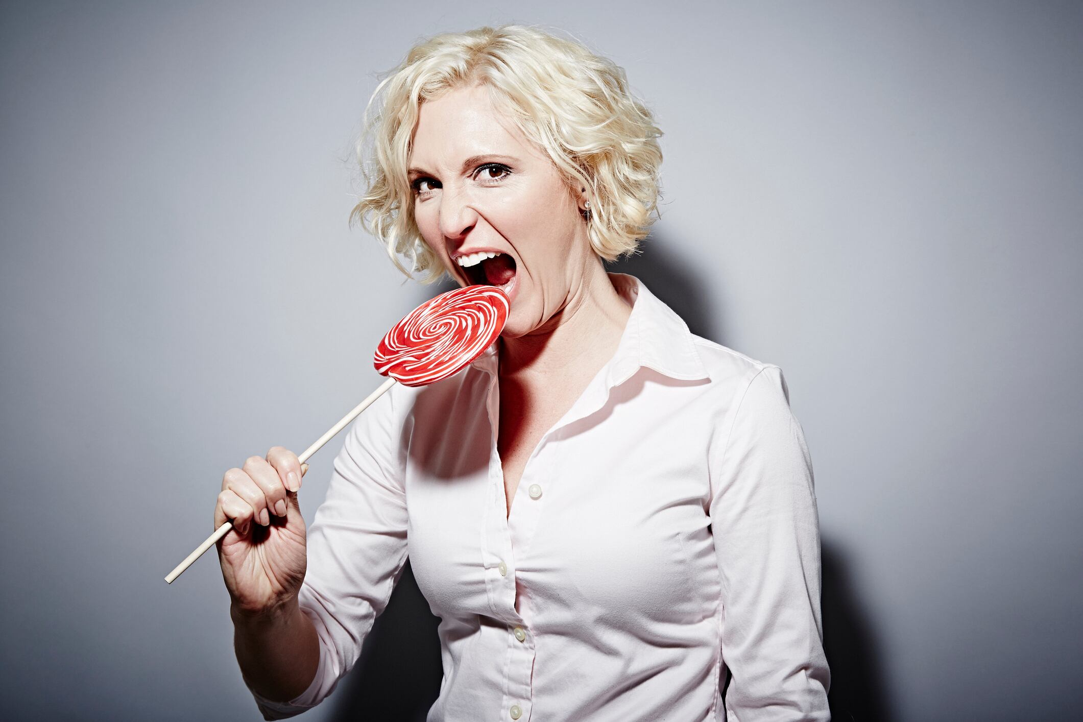 Woman eating lollipop