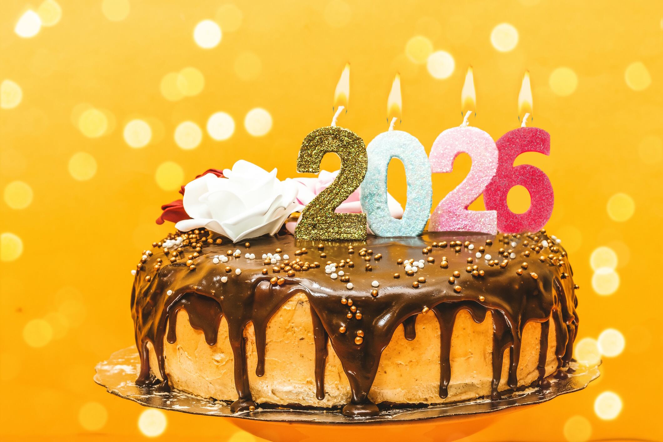 2026 new year birthday cake chocolate and cream decorated with numbers candle and flowers