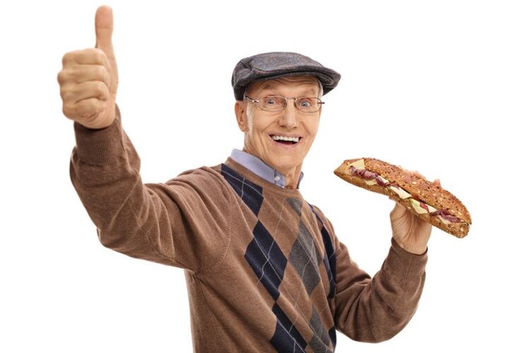 Older-man-eating-sandwich-thumbs-up-Ljupco.jpg
