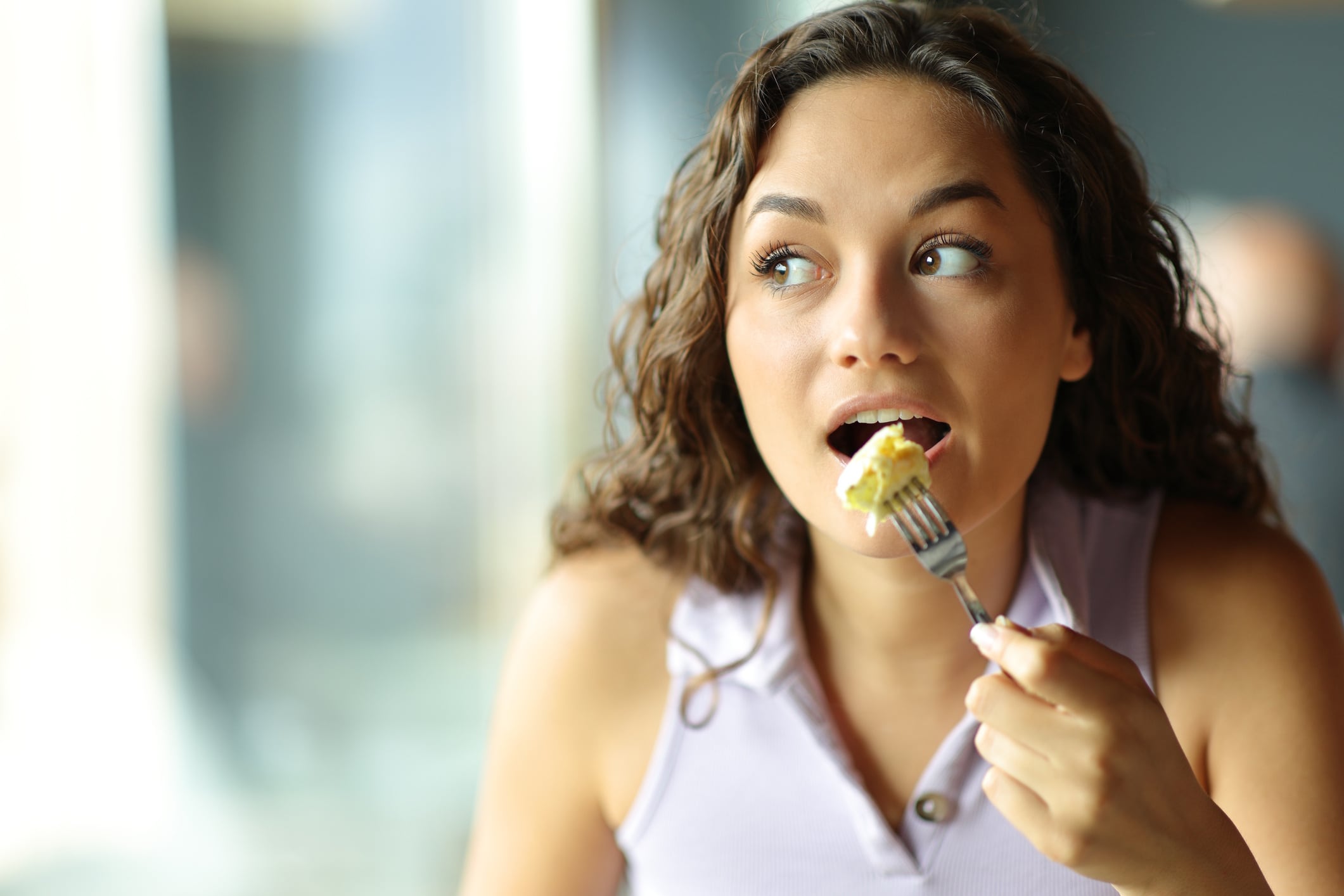 Woman eating omelette Pheelings Media GettyImages-