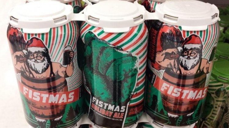 Revolution Brewing's Fistmas holiday ale is poured into festive cans.